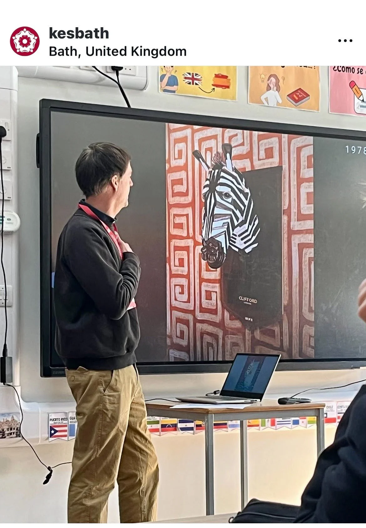 Marc Hackworthy standing in front of a screen giving a workshop to students at King Edward School, Bath.