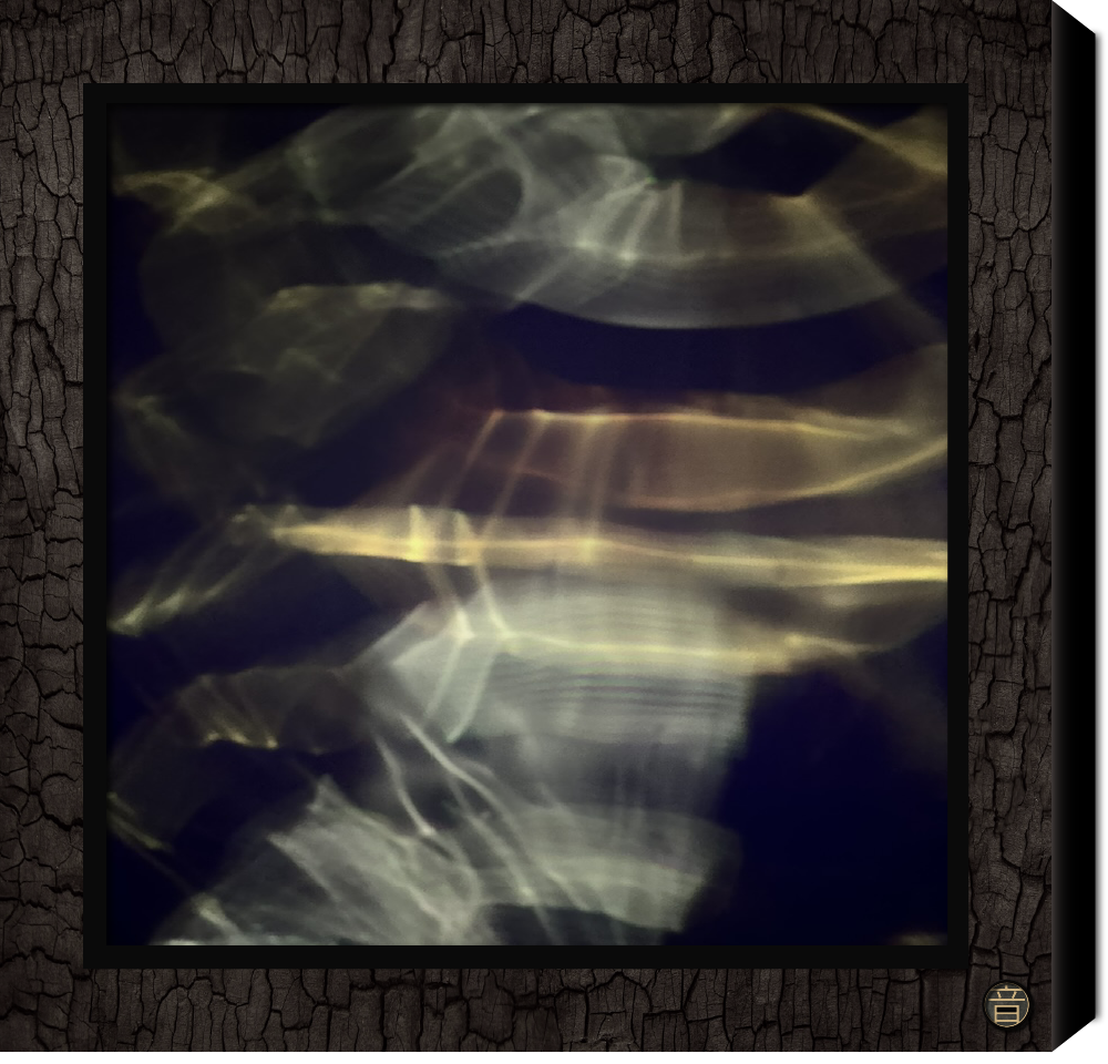 Abstract cymatic image of light reflections on water creating wavy, streaked patterns in shades of yellow, white, copper with a hint of  blue. In chard Shou Sugi Ban wood frame 