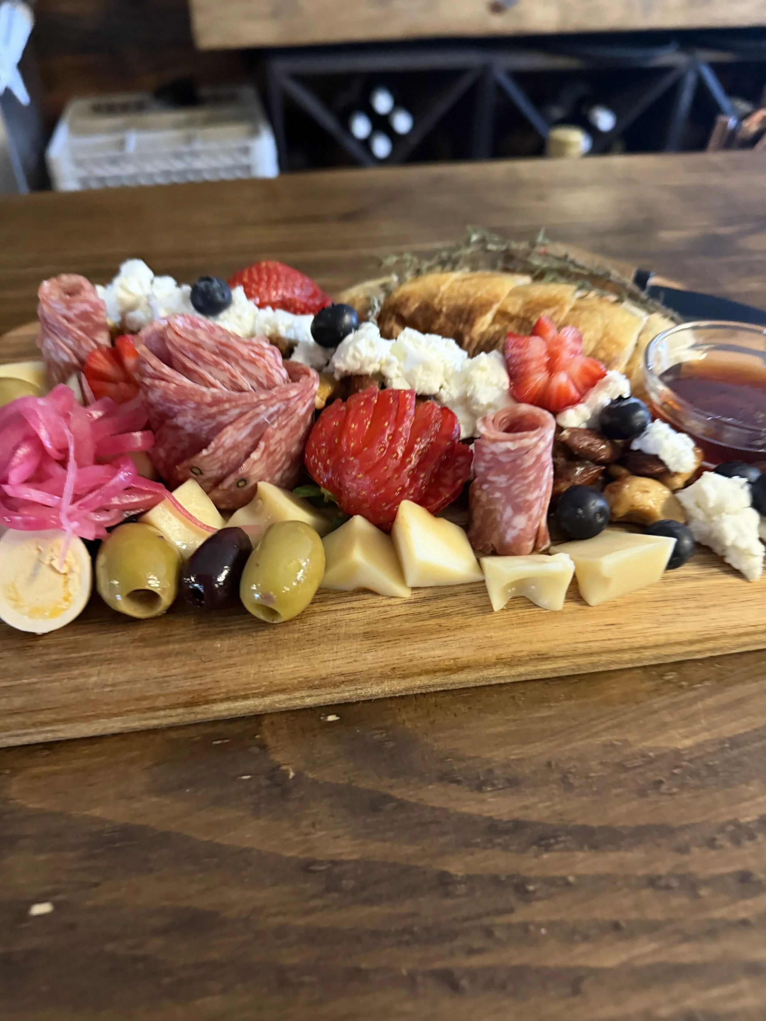 Vinland Hays Manor Board with cheeses, cured meats, fruit, olives, nuts and bread