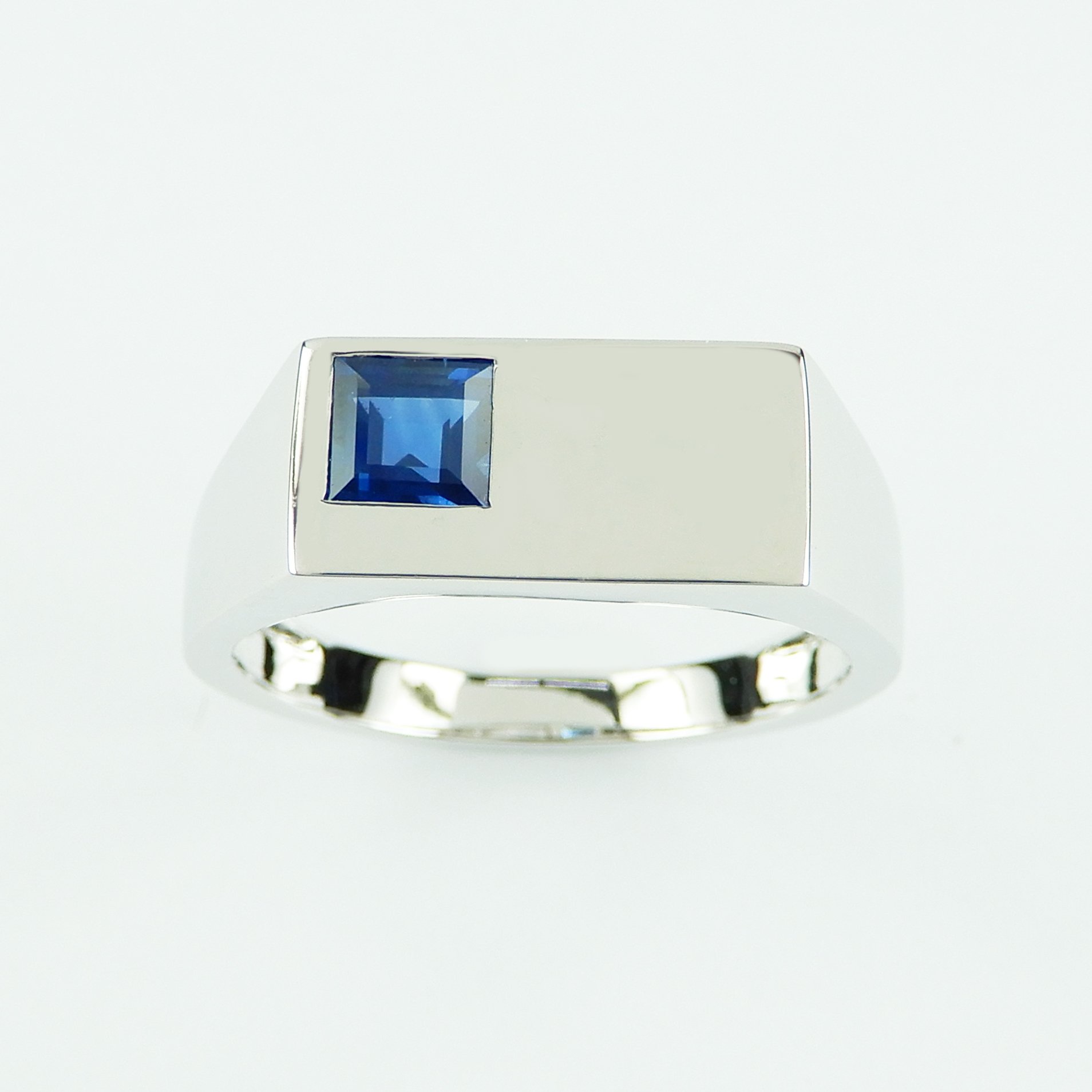 Handcrafted 14k white gold signet ring set with a square-cut unheated Kanchanaburi blue sapphire. A solid, heavyweight heirloom piece.