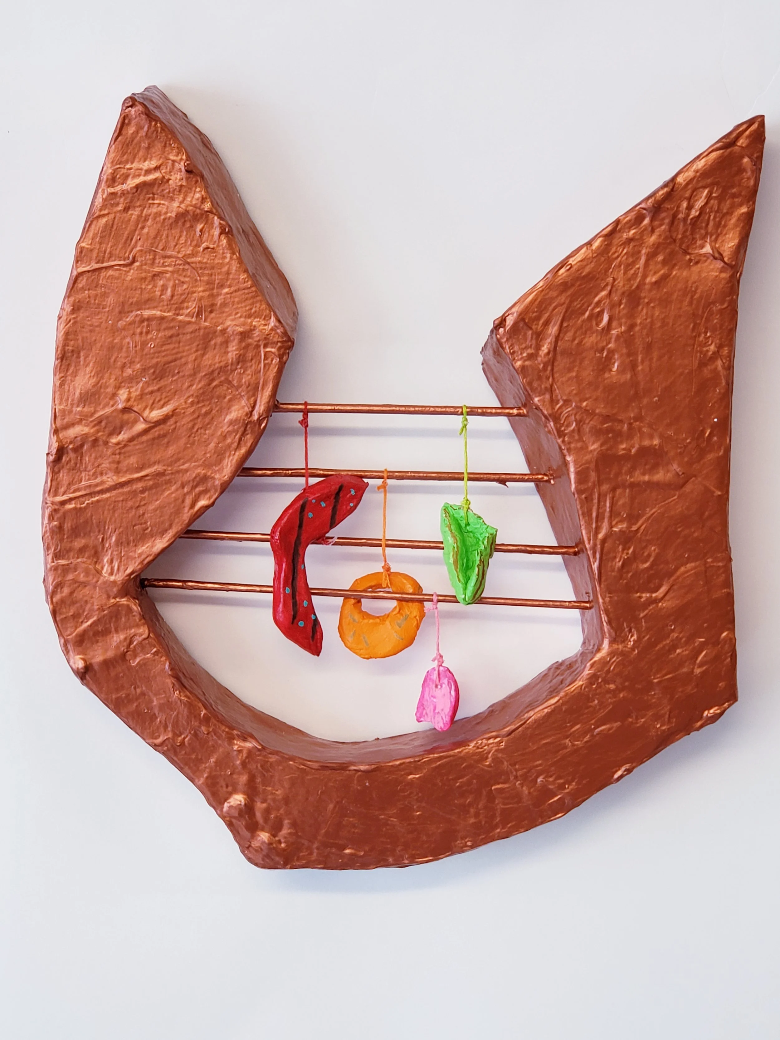 Making music, 12 x 12 x 2in, 2022 paper mache, wood, clay, acrylic