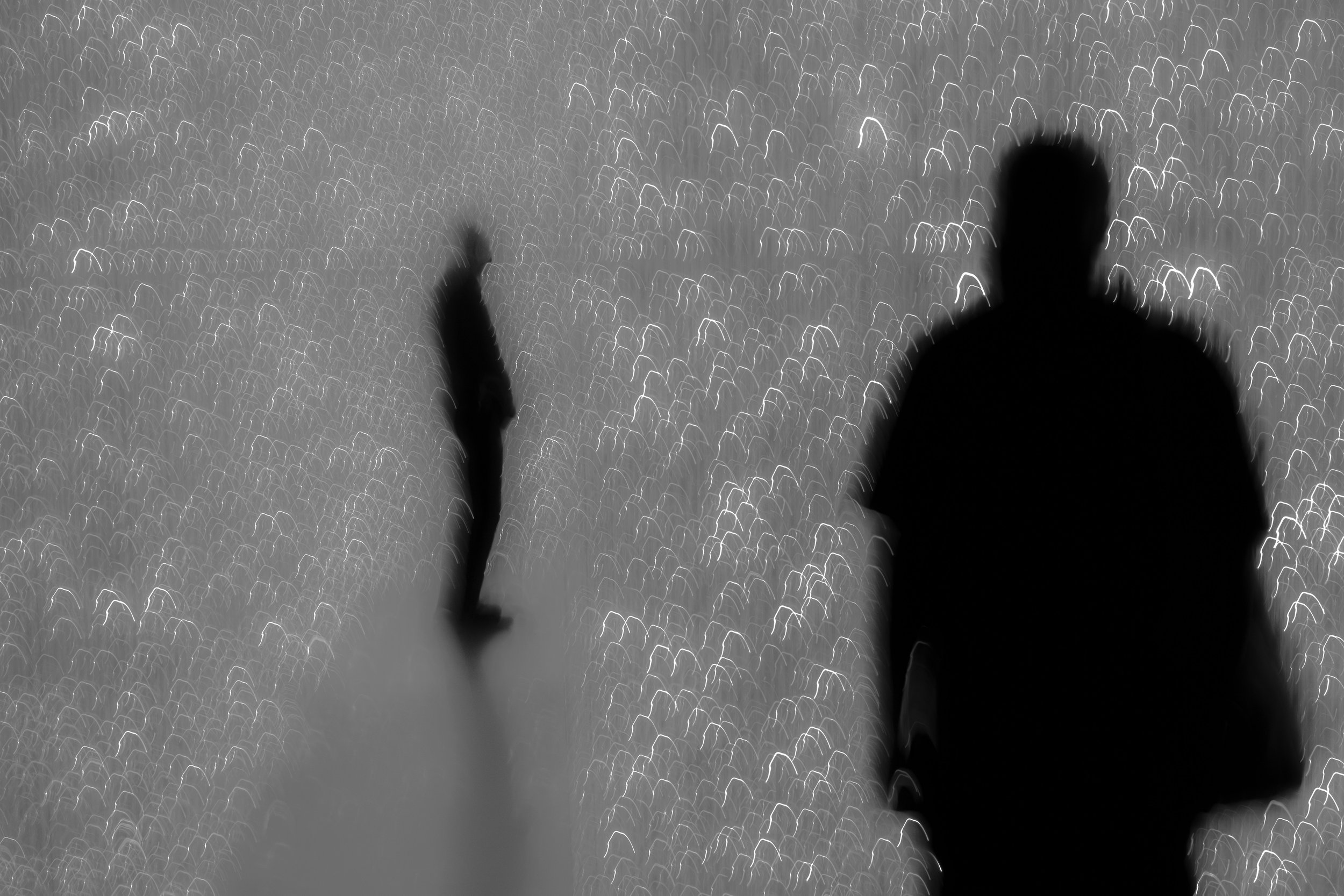 Distance - Two figures adrift in a cosmic field of light. Swallowed by distant silence.