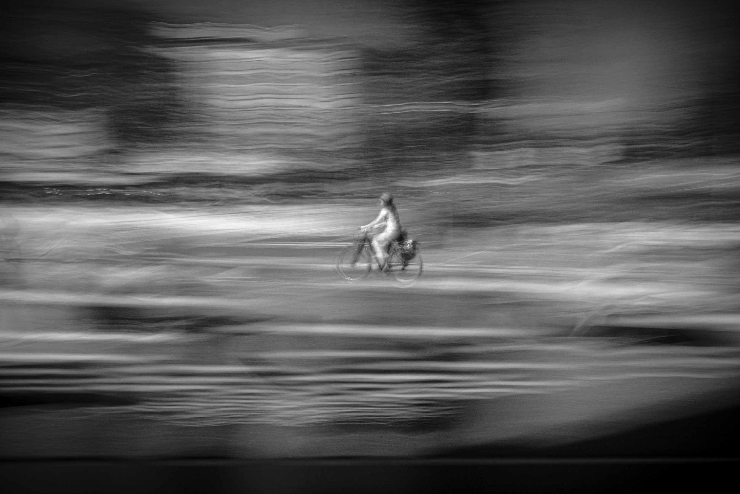 Biking through the Storm - Alone in a silent world, riding on the edge of emptiness.