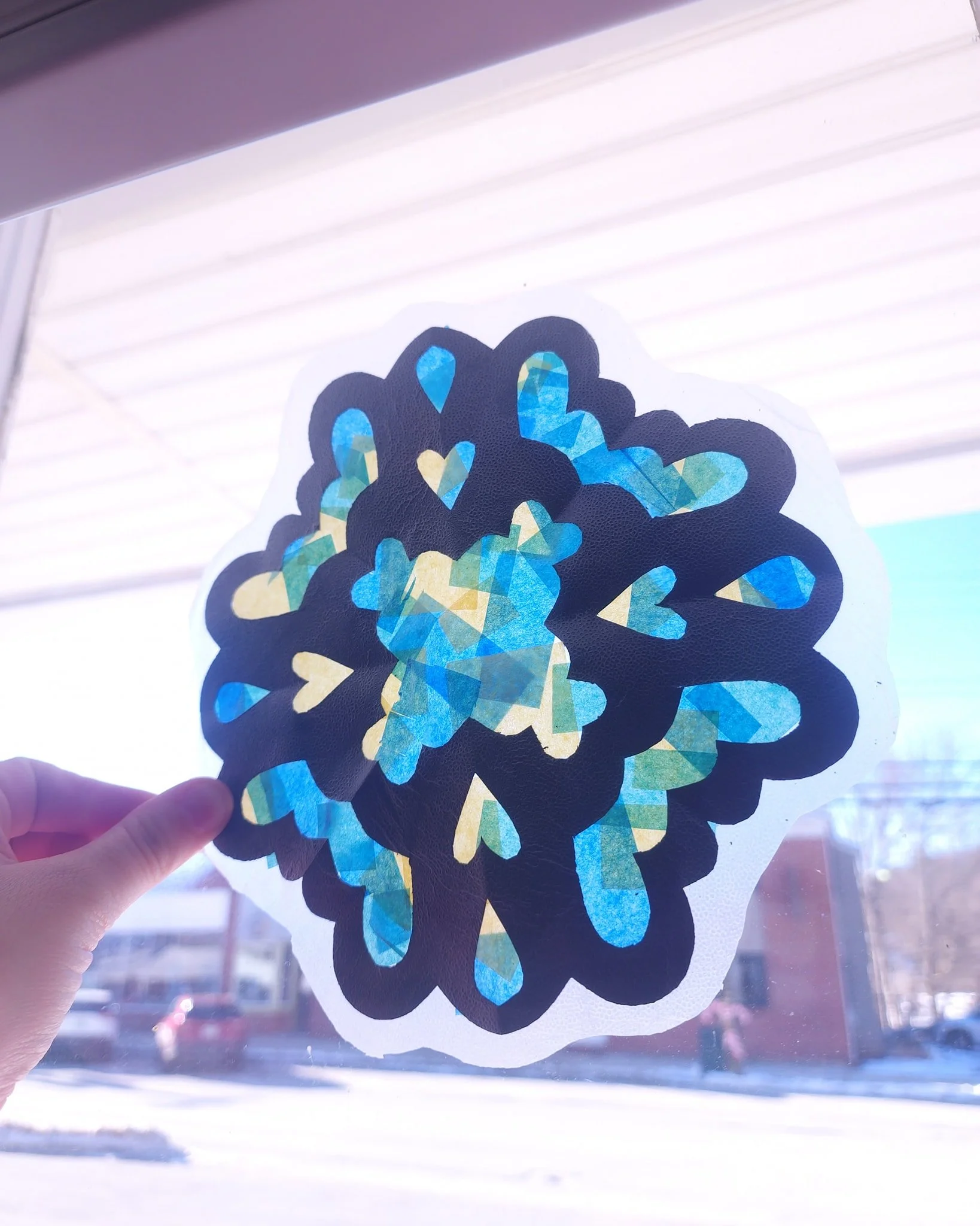 Join us tonight at 5 pm to make stained glass paper snowflakes! They look so beautiful up against the light ❄️