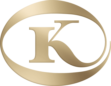 Gold logo with a capital letter 'K' inside an oval shape.