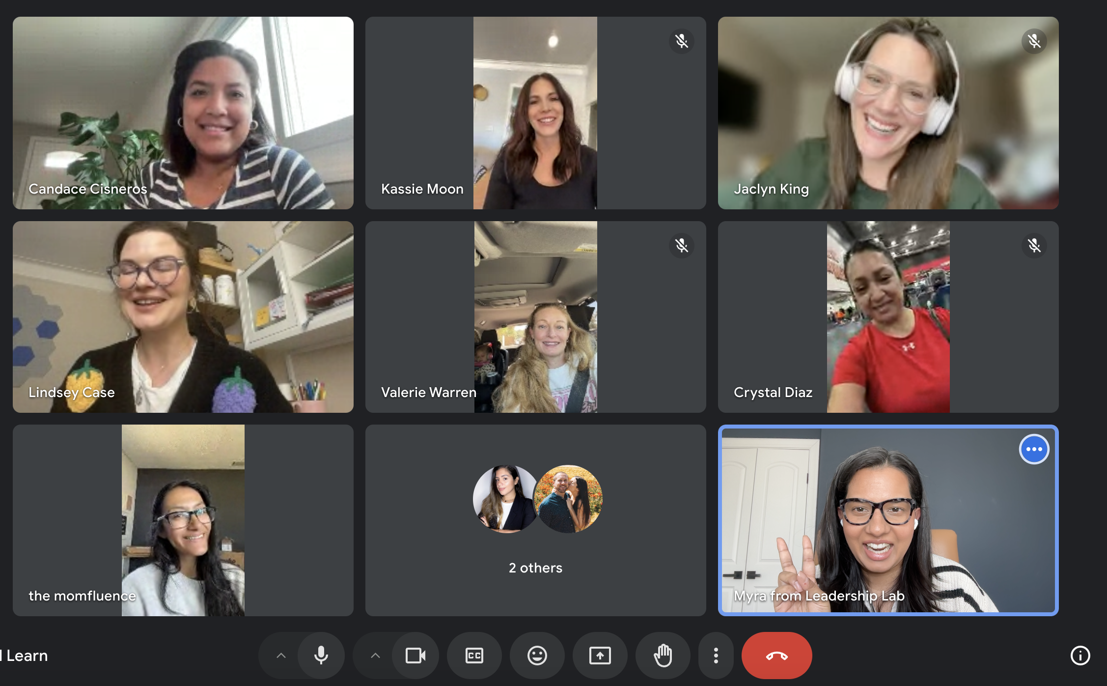 Screenshot of a virtual meeting with multiple women, some smiling and engaging. Participants are in various settings, including home offices and casual spaces.