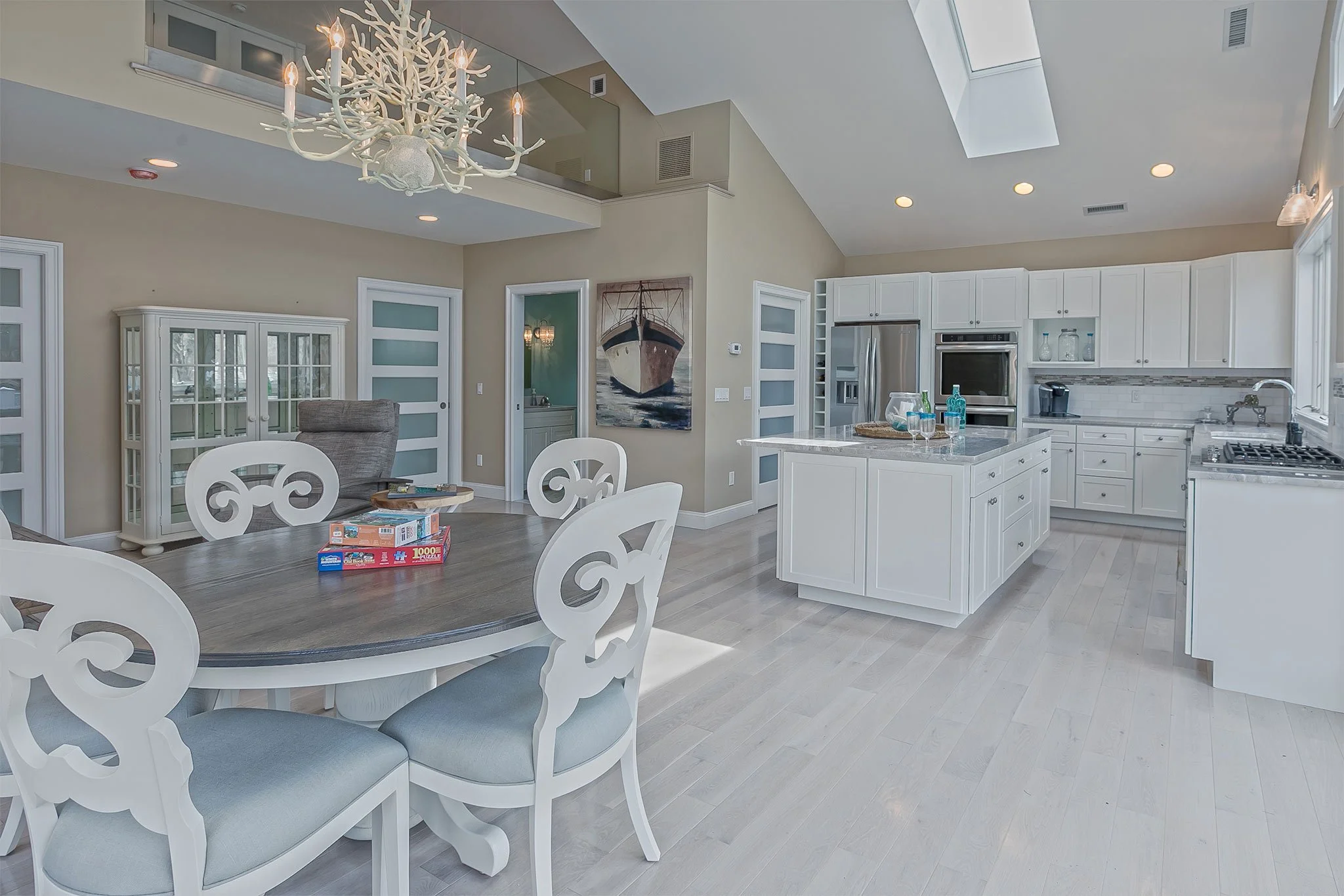 Kitchen
Once enclosed and utilitarian, the kitchen now anchors the heart of the home with openness and warmth. The finishes mirror the river’s palette — driftwood tones, muted stone, and a glint of brushed steel. Every surface reflects intention; eve