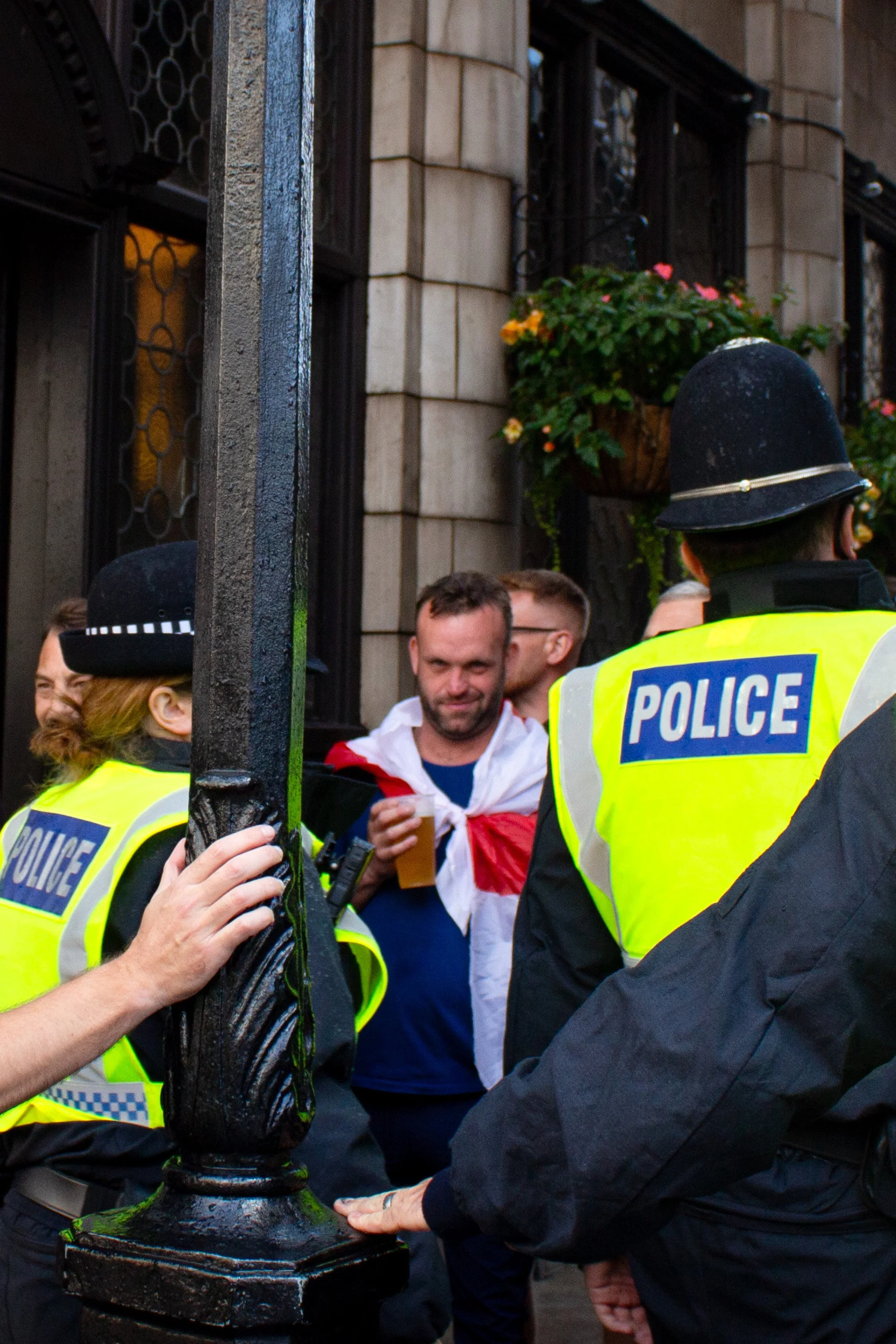 A man looks at the photographer.