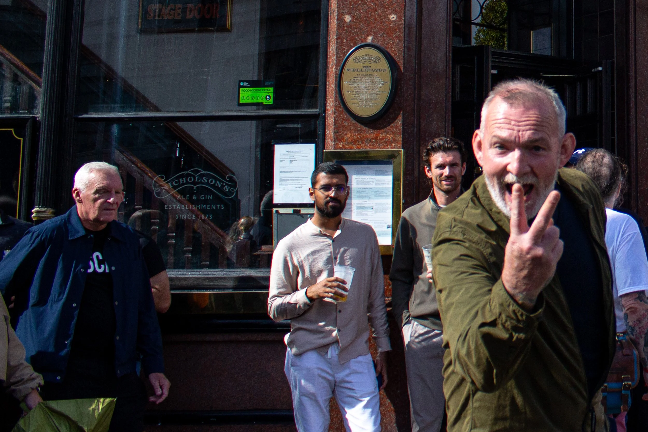 A man swears at the photographer.