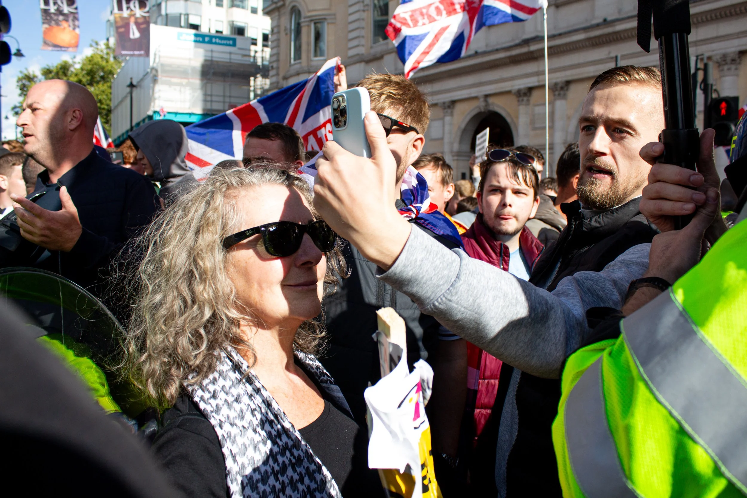 A counter protestor stands between the far-right and other members of the counter protest.
