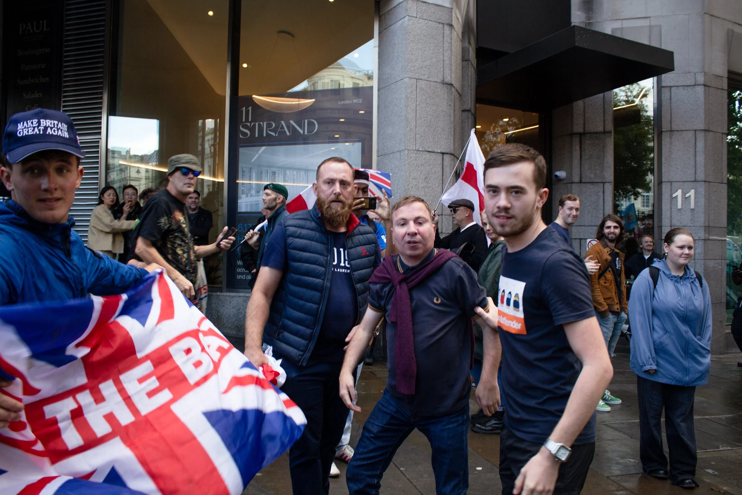 Far-right protestors along the side of the road.