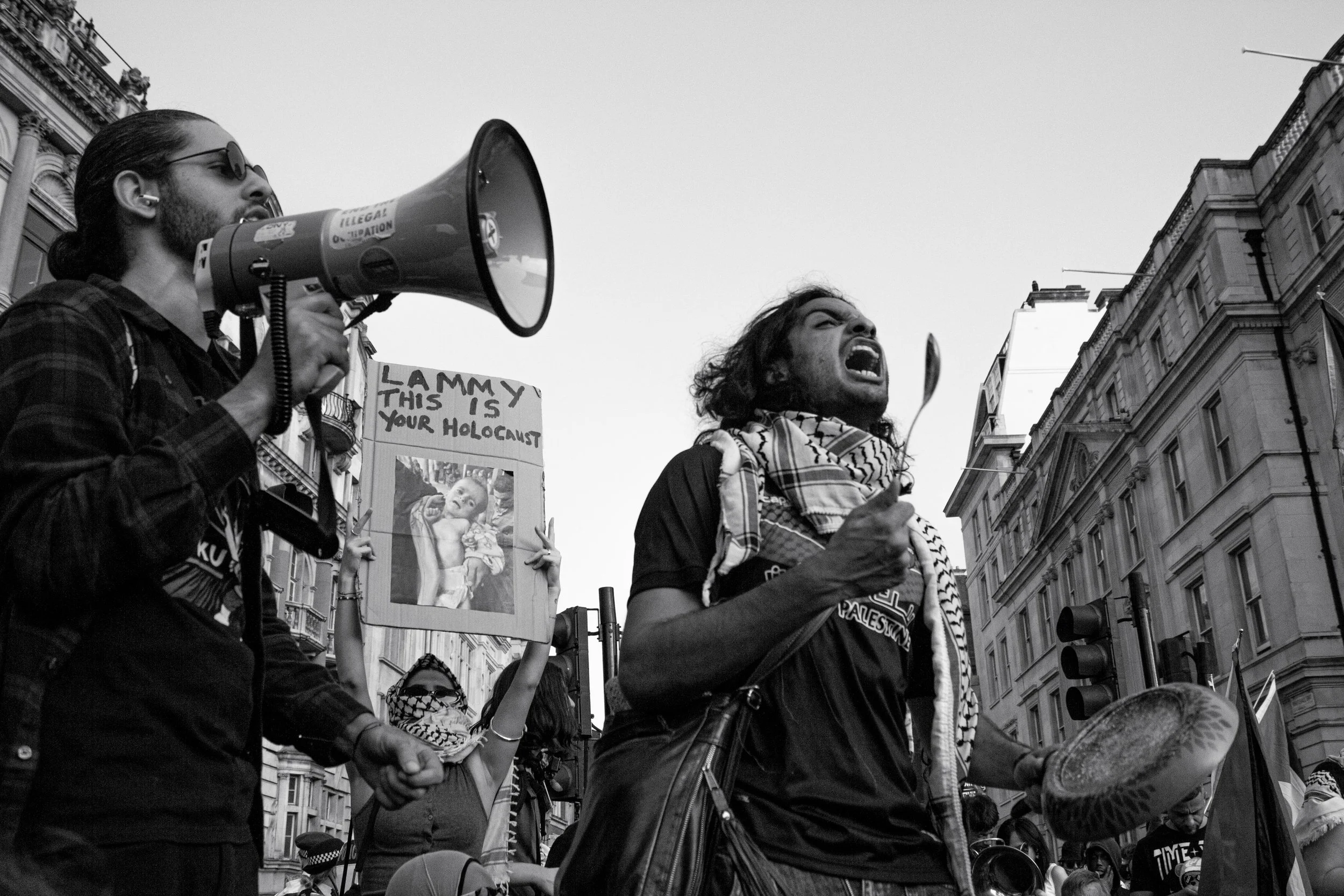 Protestors block the Trafalgar Square roundabout, protesting the UK government's complicity in the ongoing genocide and famine in Gaza, 2025. (1/2)