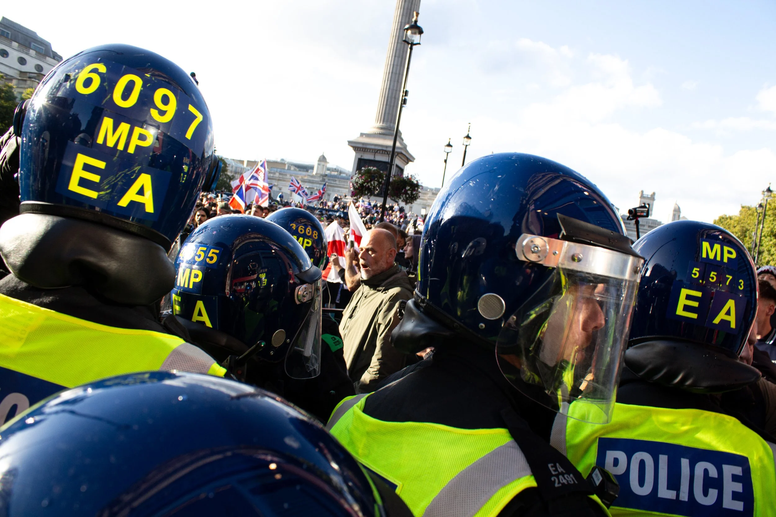 Riot police continue advancing towards the crowd.