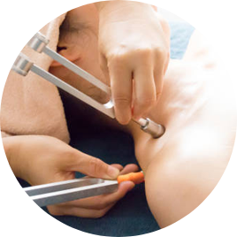 Close-up of a medical procedure involving an injection at a patient's abdomen.