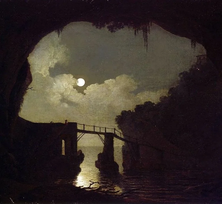 Nighttime scene of a moonlit sky seen from inside a cave with a bridge over a body of water, surrounded by trees and clouds.
