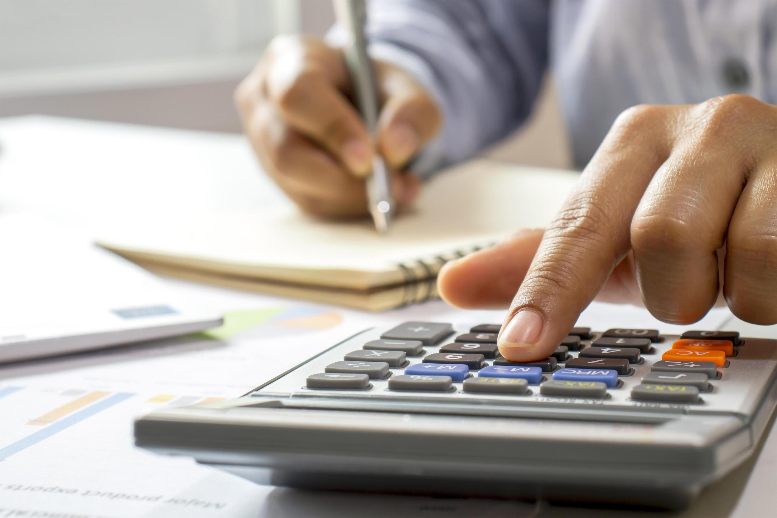Oranssi technician working on a roof project