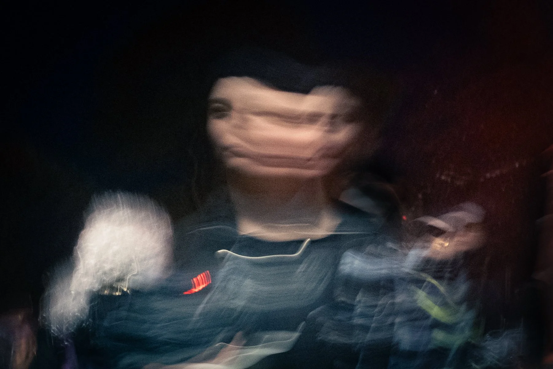 a surrealistic color photo, the photographers process has made the person look like there is 2 of them, like the star sign gemini
