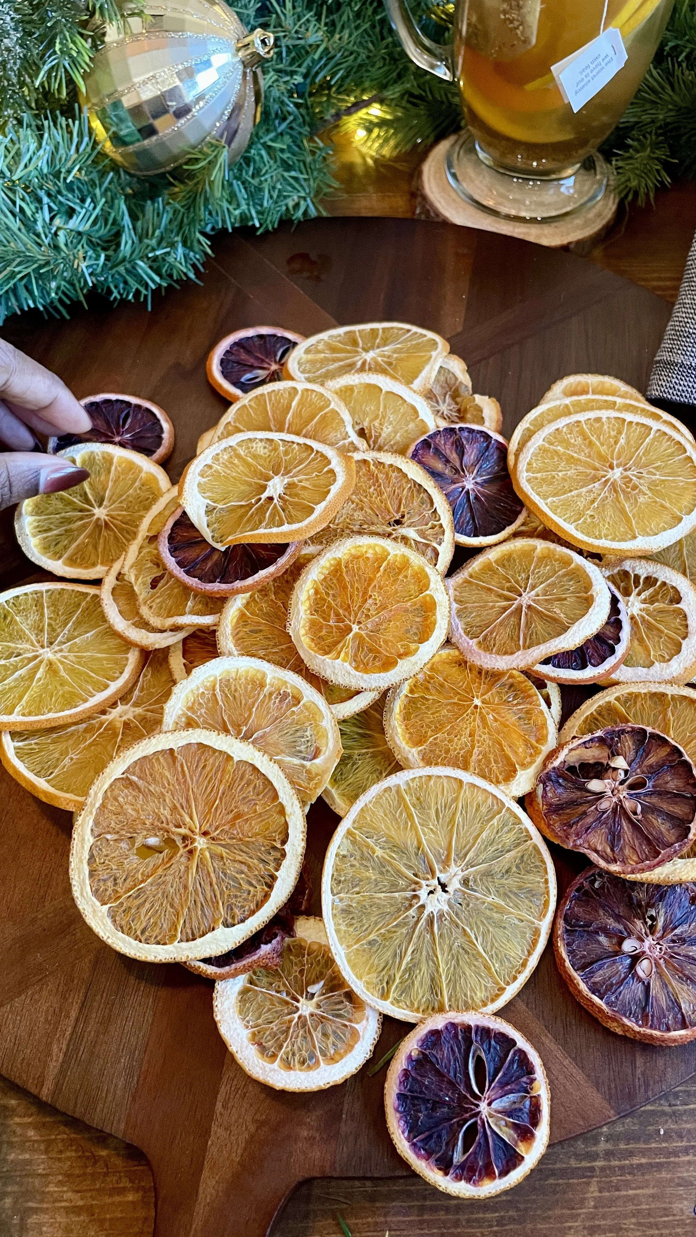 Hand Reaching for Oranges.JPG