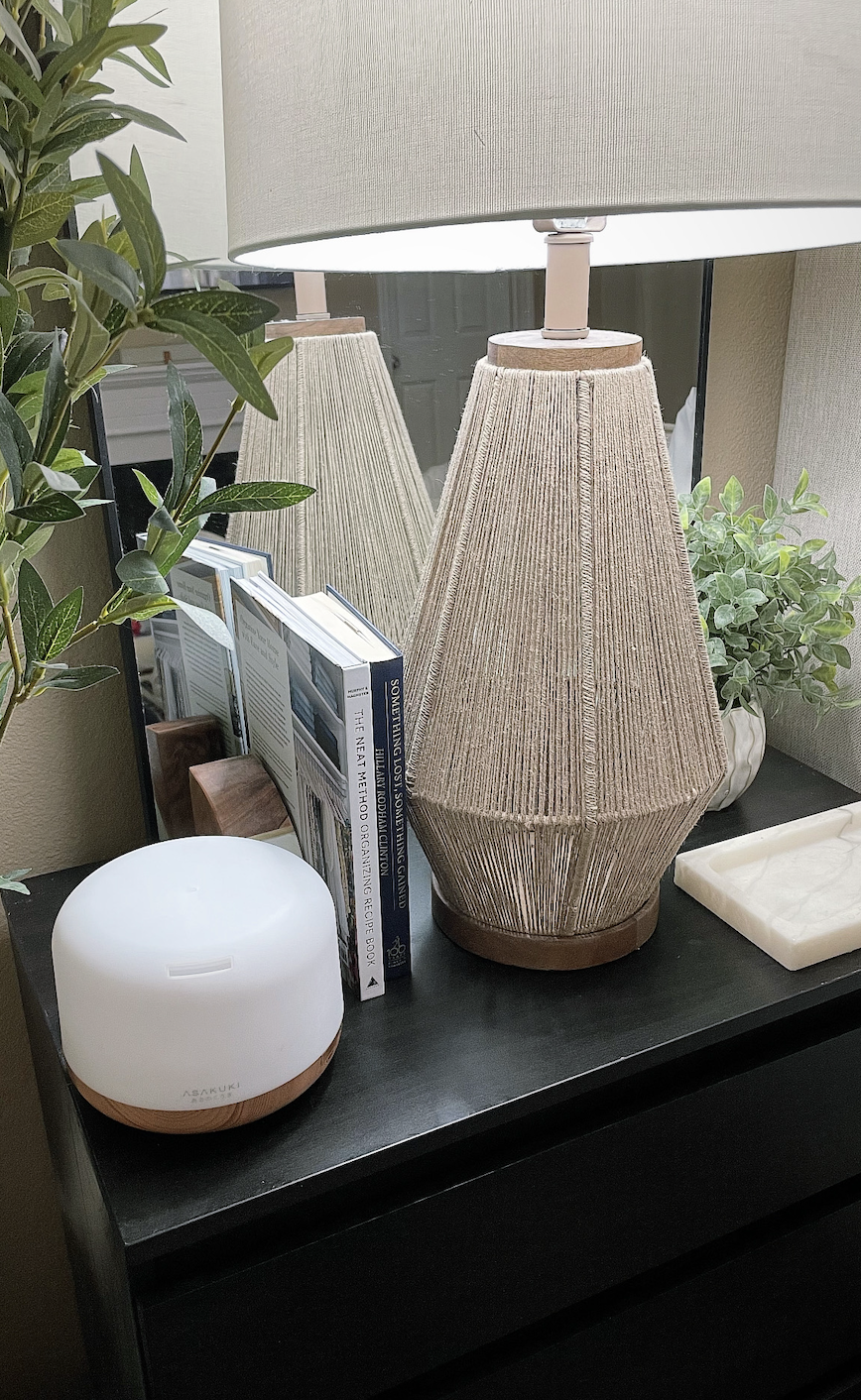 Nightstand setup with diffuser and lamp creating a calming nighttime routine atmosphere