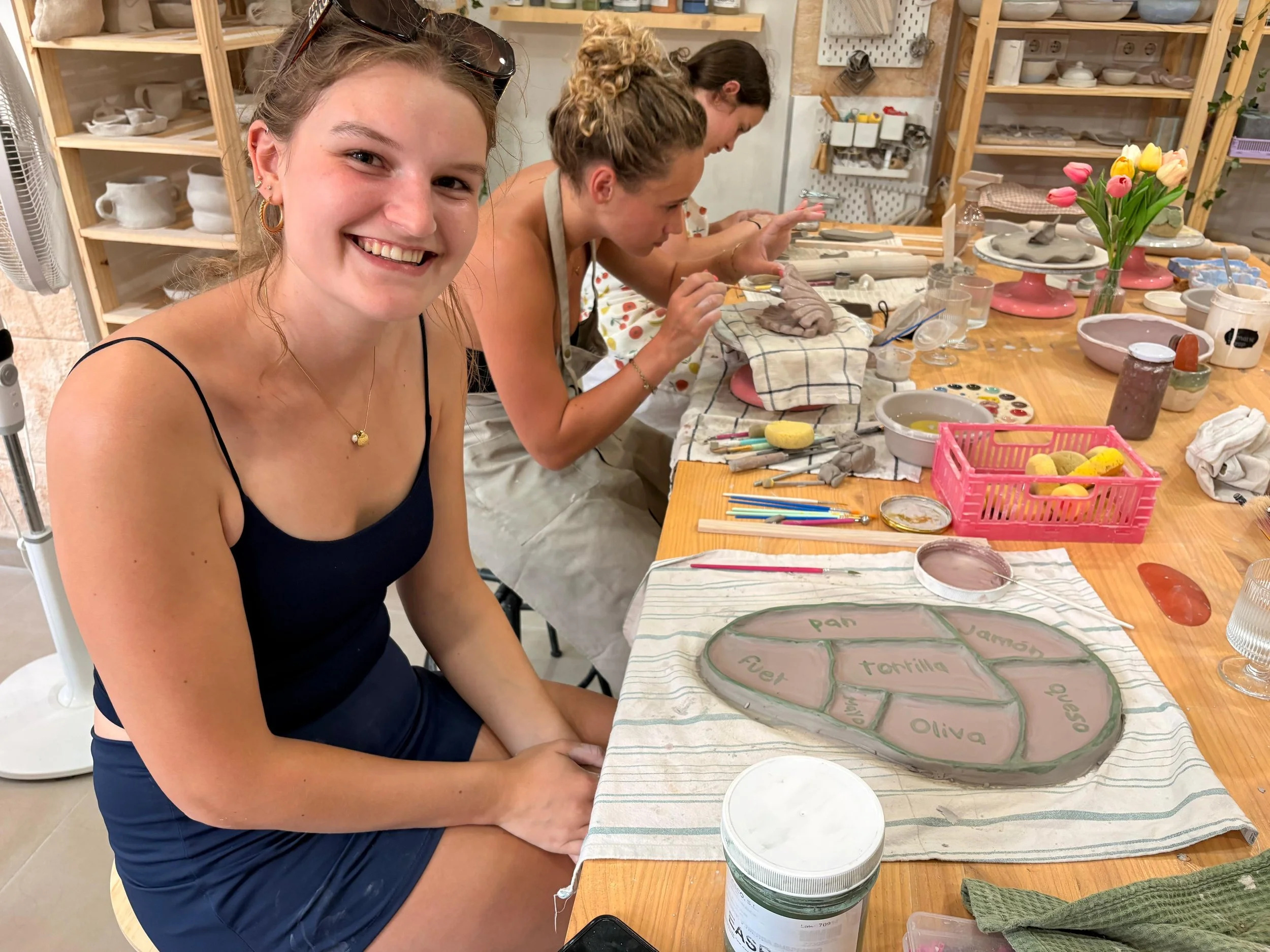 Group of friends visiting valencia doing ceramics