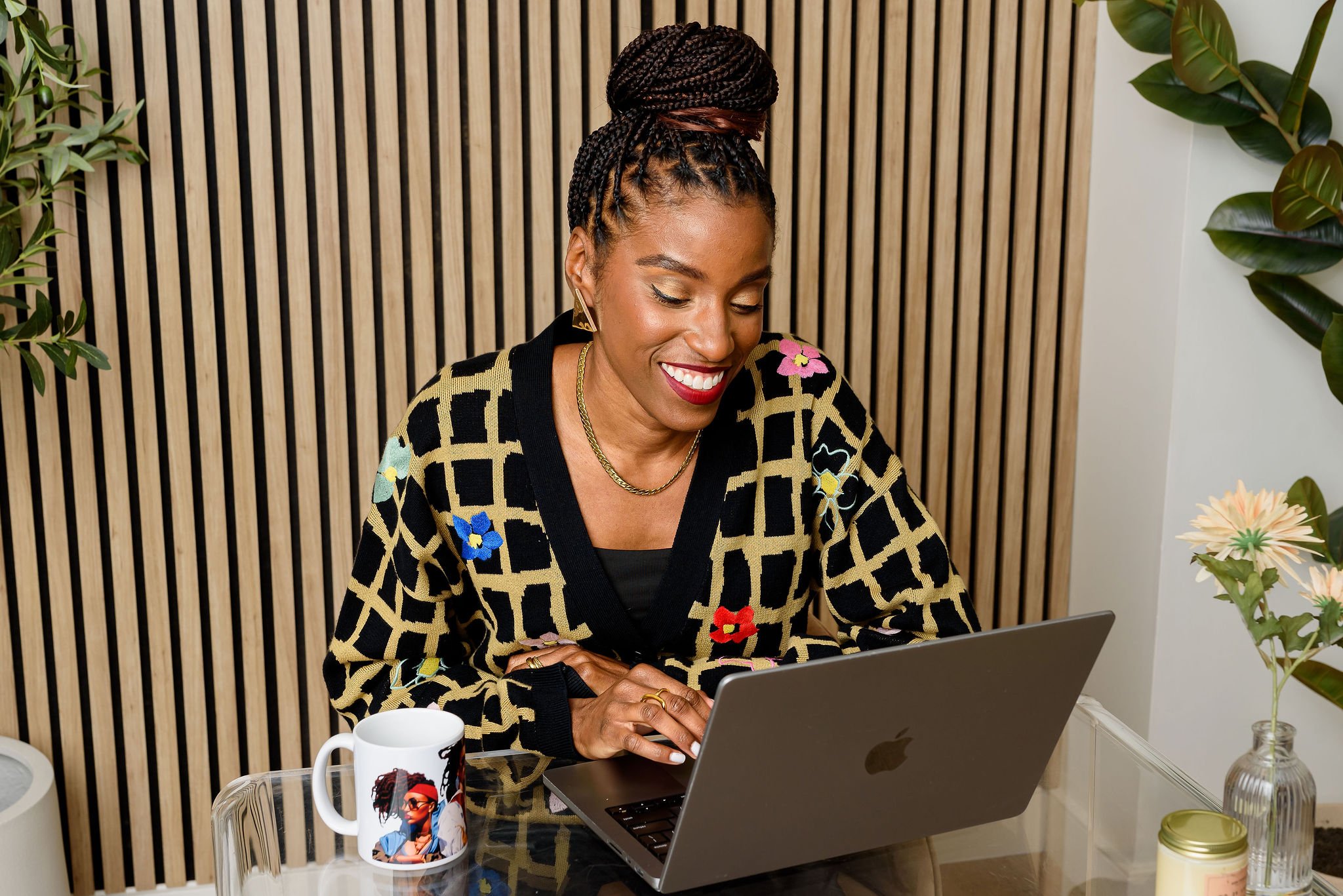 woman looking down at her laptop computer screen