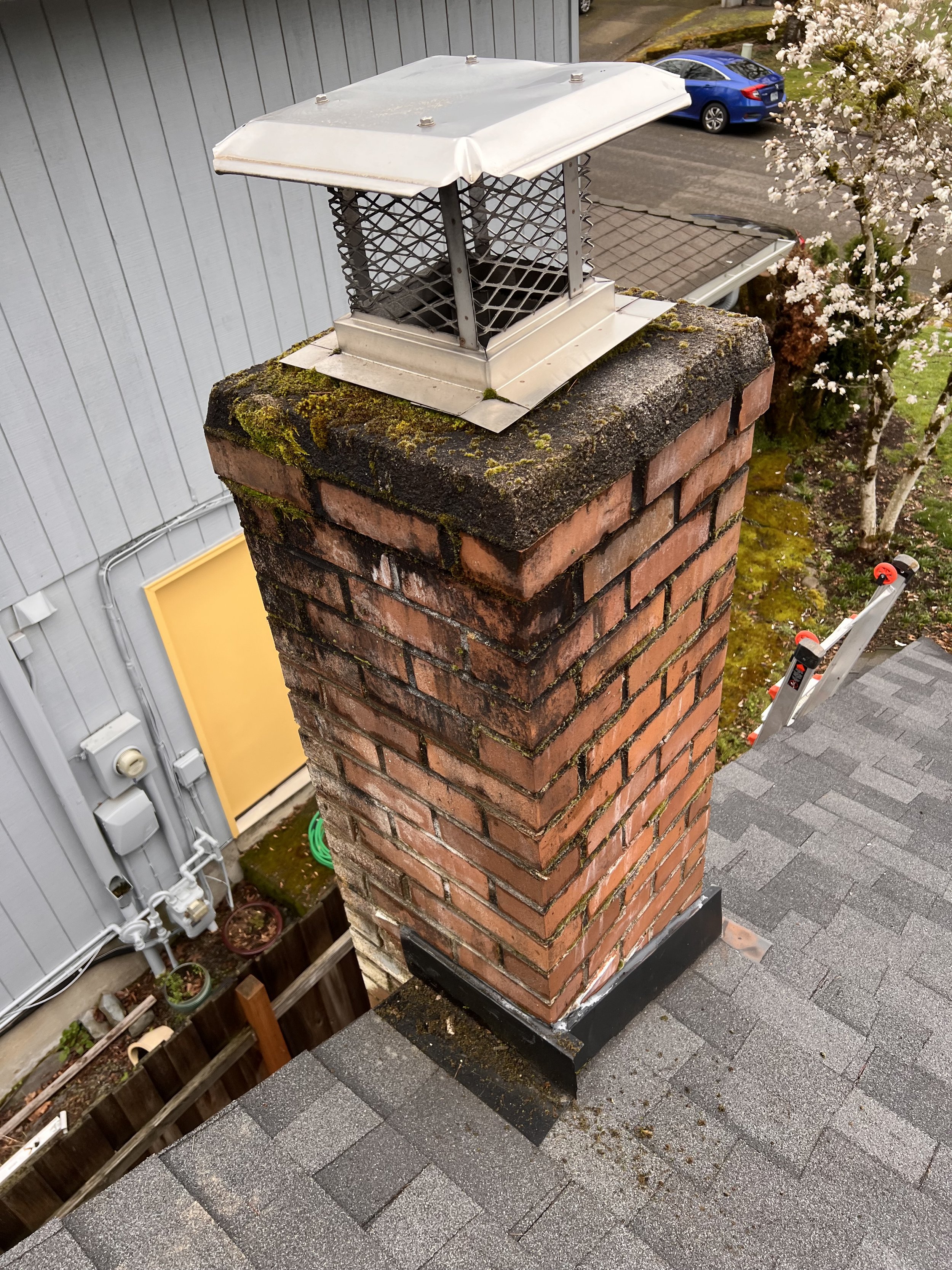 Before: Water-damaged brick from improper chimney cap installation
