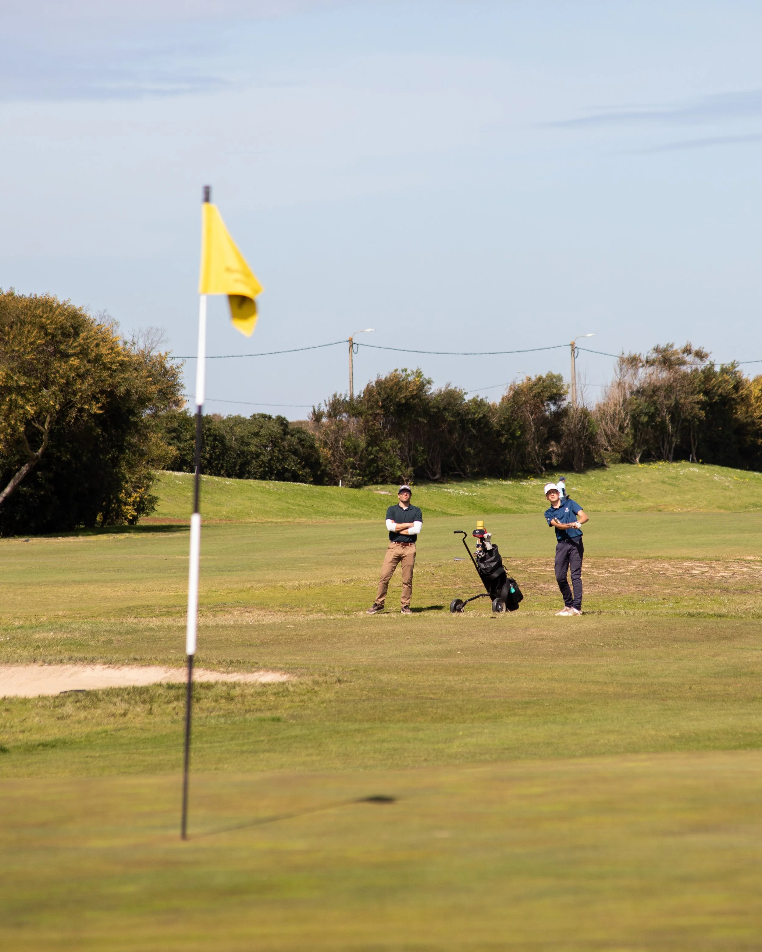 golf player with caddie