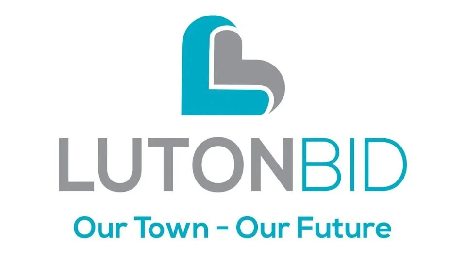 Luton BID logo with a stylized heart and the text 'LUTON BID' and slogan 'Our Town - Our Future'.