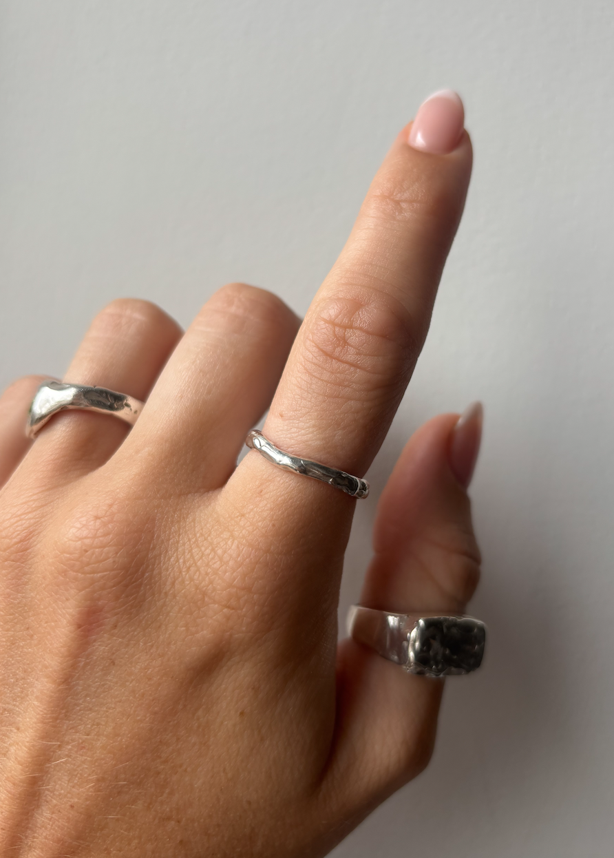 dainty organic band on finger.png