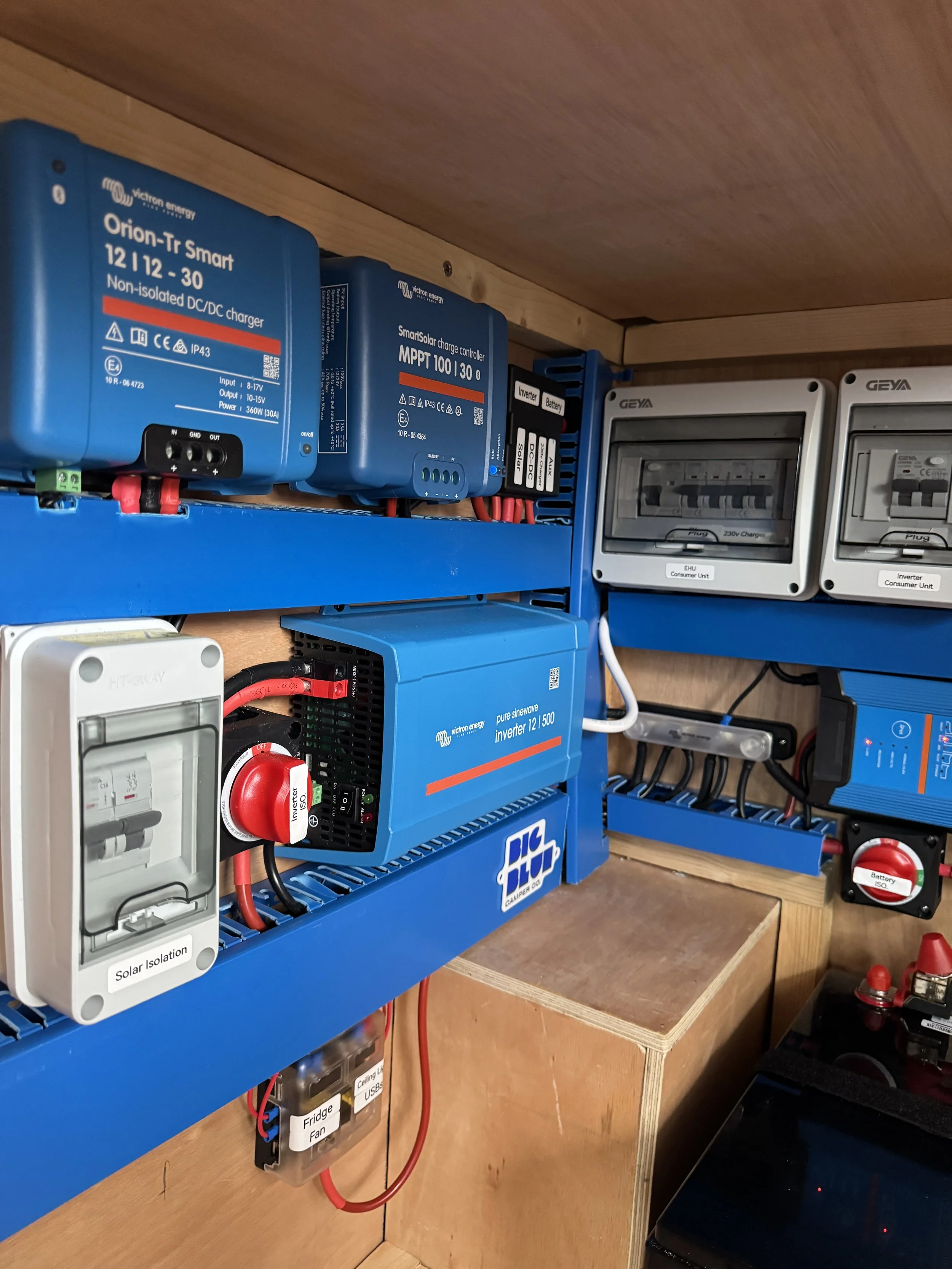 12v 230v Campervan electrical panel with Victron components, consumer units, and wiring.