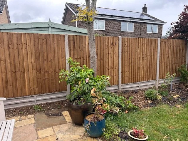 Closeboard panels in concrete posts and gravel boards. Norfolk