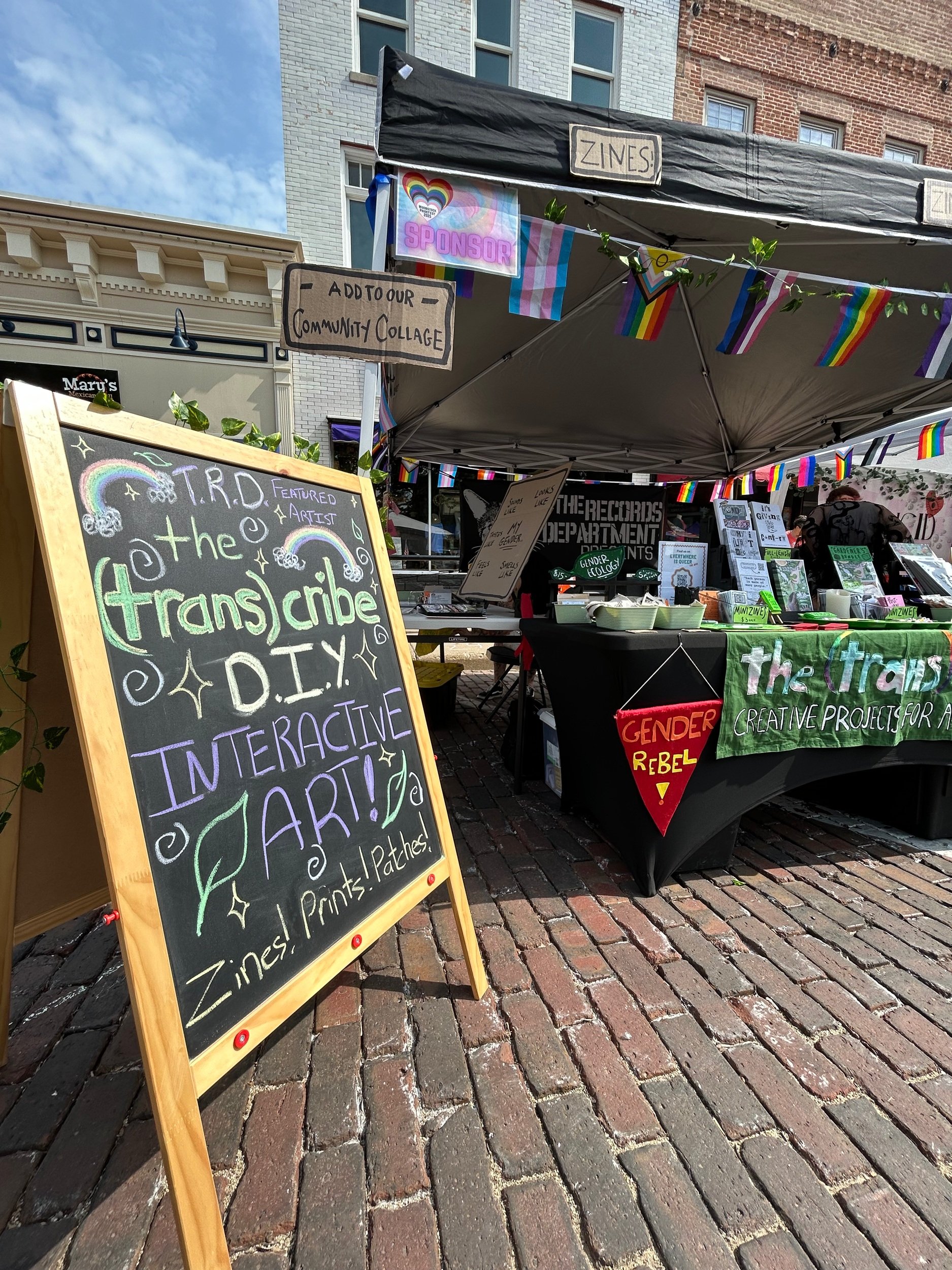 The front of The Records Department booth where I was a featured artist for the 2025 Woodstock Pride event!