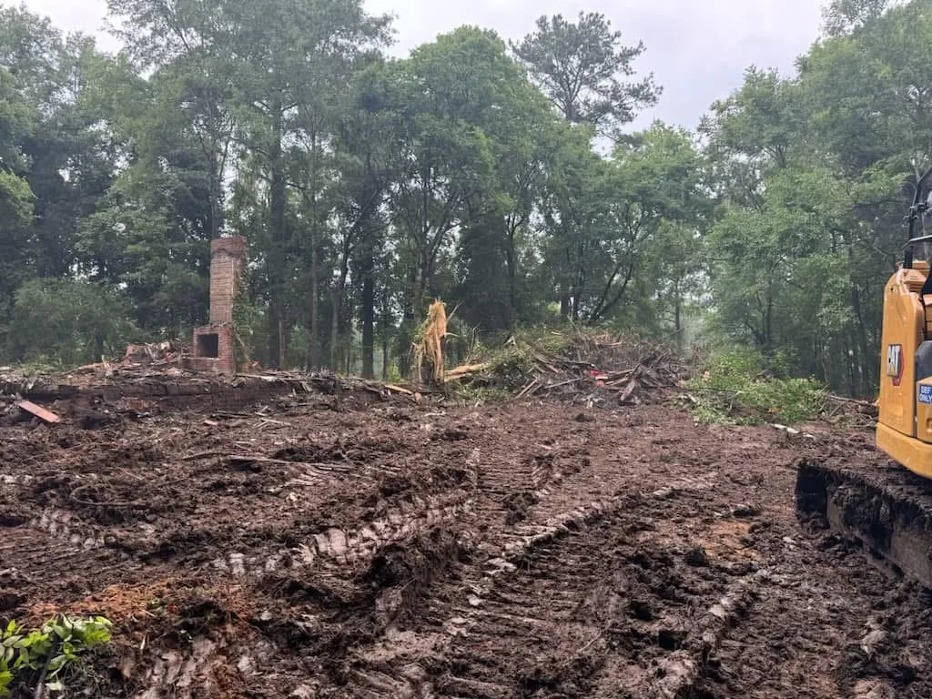 Demolition contractors removing damaged structure
