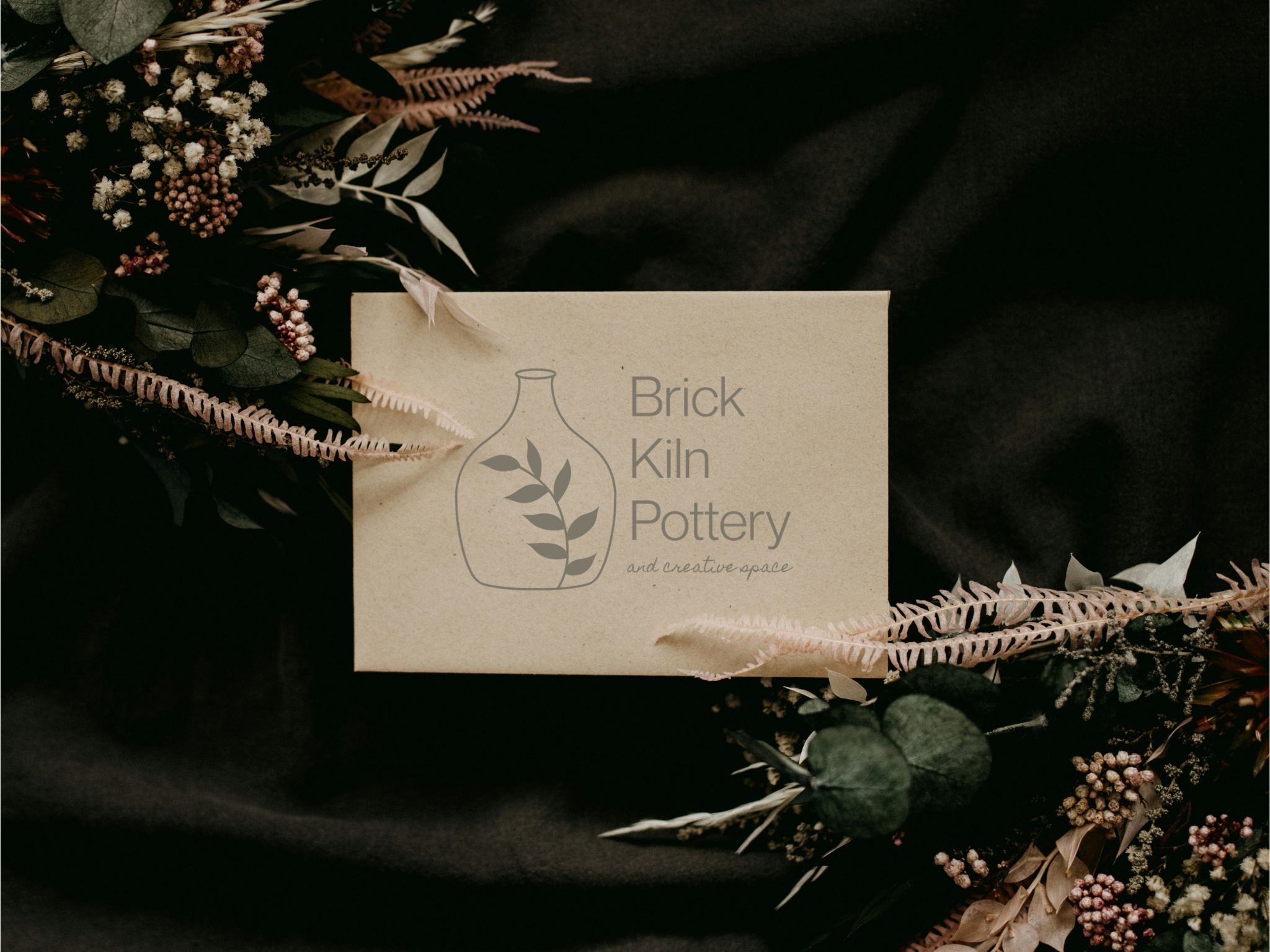 hands making a bow on a sealed envelope 