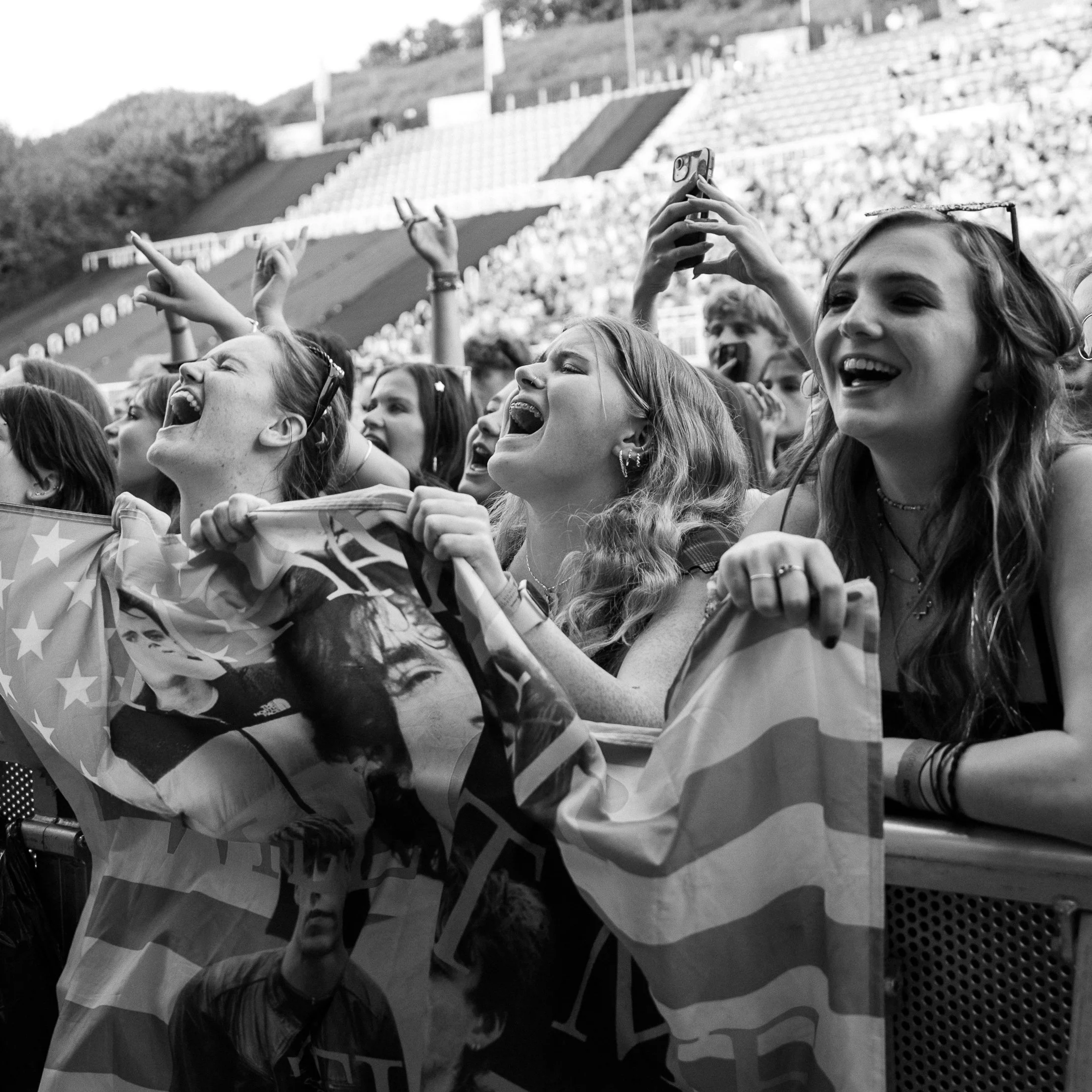 Screaming fans of Inhaler the band. Excited for the show an showing what the crowd is like at a summer festival.