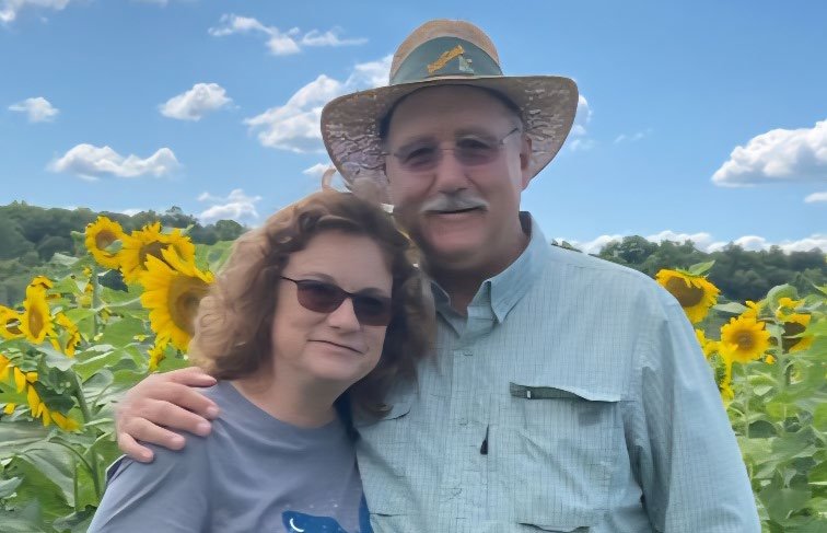 Tony and Lyn Martin in front of sunflower field