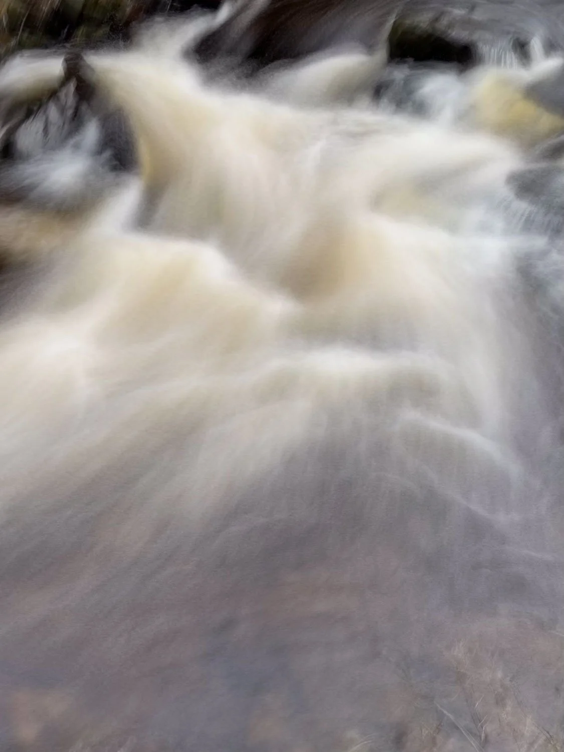 Holme river in spate in Holmfirth.jpg
