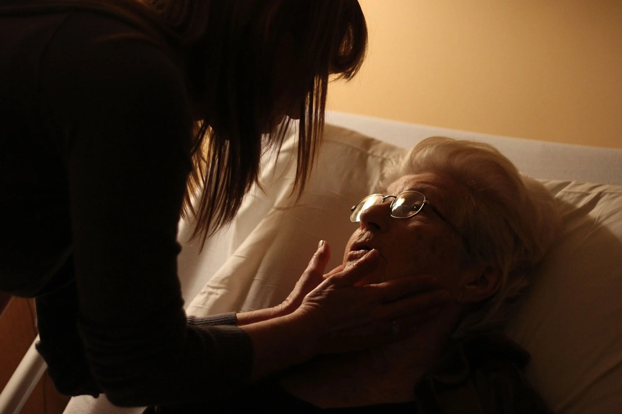 Margie Montgomery is kissed goodnight by her granddaughter while under the supervision of staff at HospiceCare of the Piedmont on Nov. 16, 2010. Montgomery was admitted to hospice care following a heart attack at her home on Thursday, Nov. 11, 2010. 