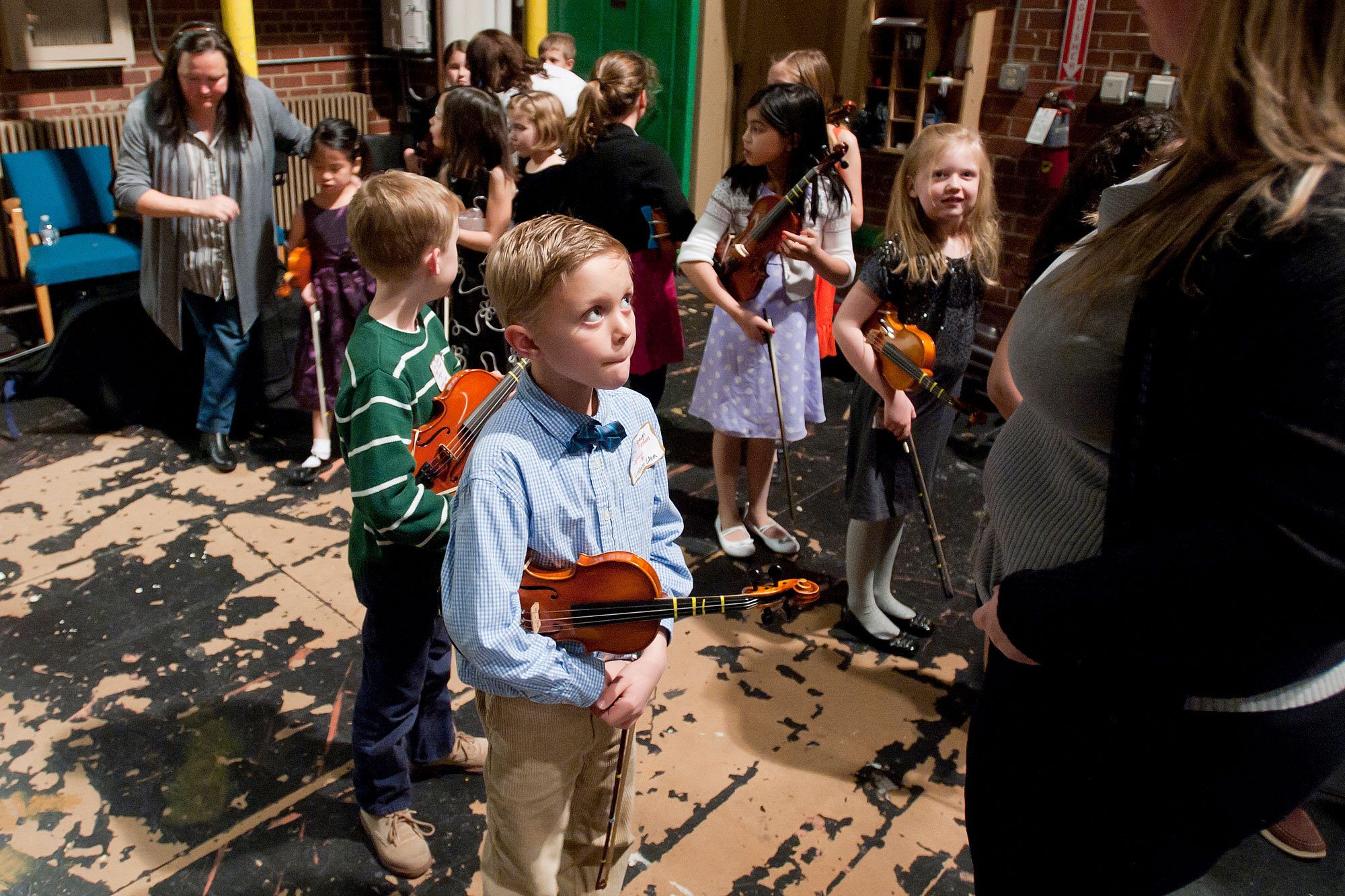 Carson Kavanaugh, of Linkhorne Elementary School, braces himself before taking the stage at E.C Glass High School's auditorium to perform "Orange Blossom Special" at the 42nd annual Suzuki Festival Concert on March 14, 2013.