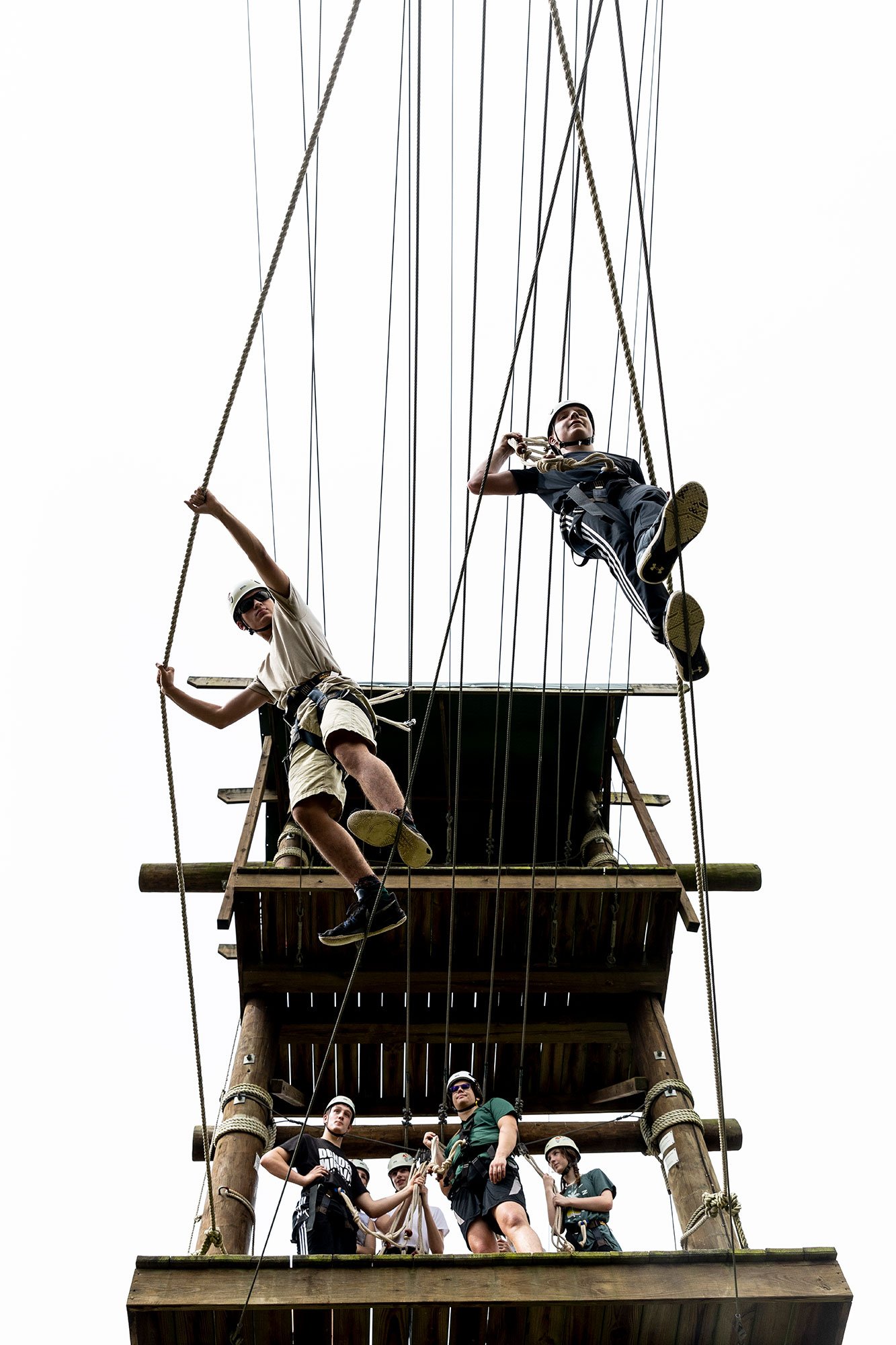 A group participates in a team-building exercise on the Odyssey High Ropes Course at the Venture Out on July 28, 2022. The course challenges teams to build trust and communicate effectively while 35 feet above the ground.