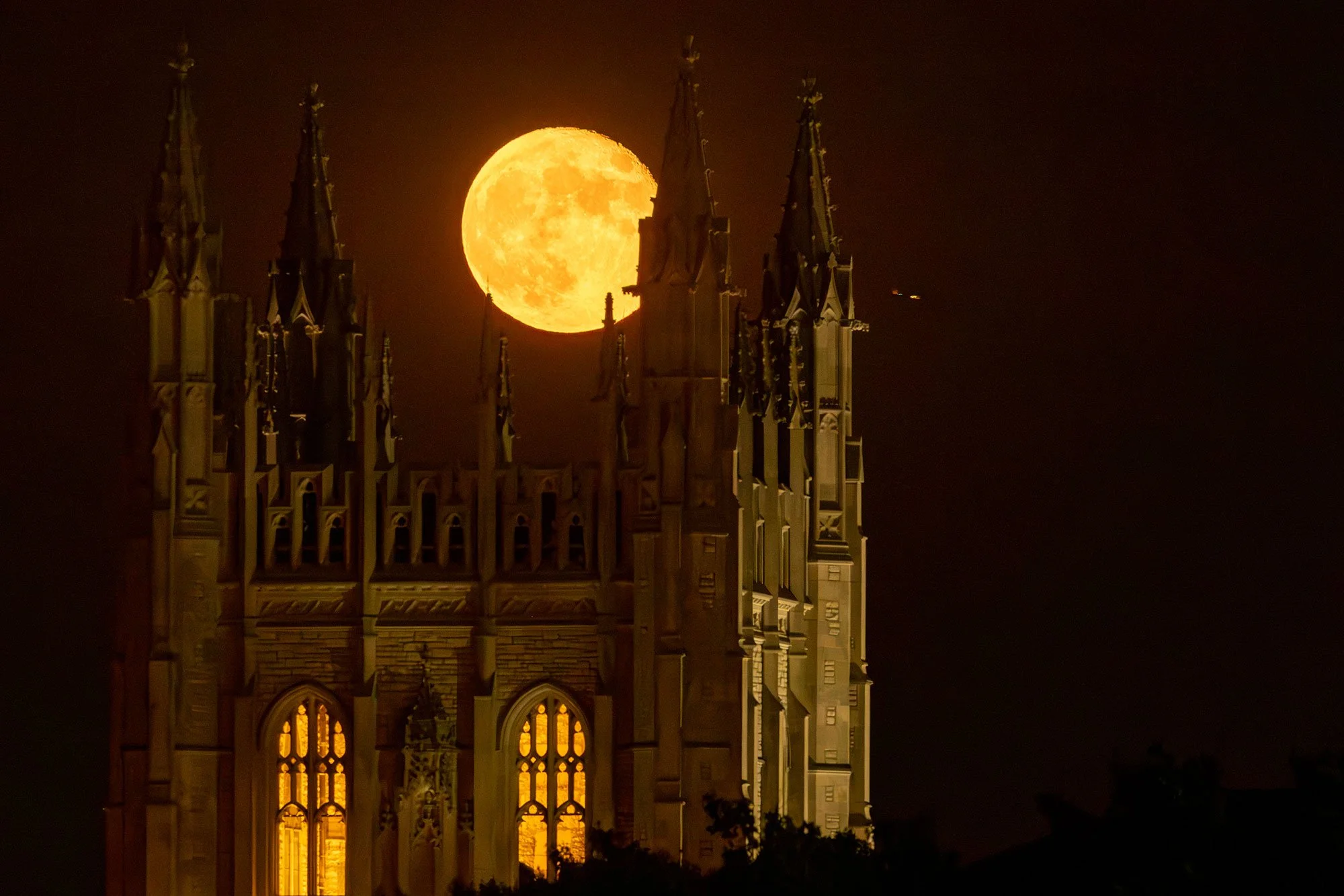 The harvest moon rises behind the Memorial Student Union on Sept. 30, 2023. During homecoming in 1926, the tower was formally dedicated to honor the 117 University of Missouri alumni who lost their lives in World War I.