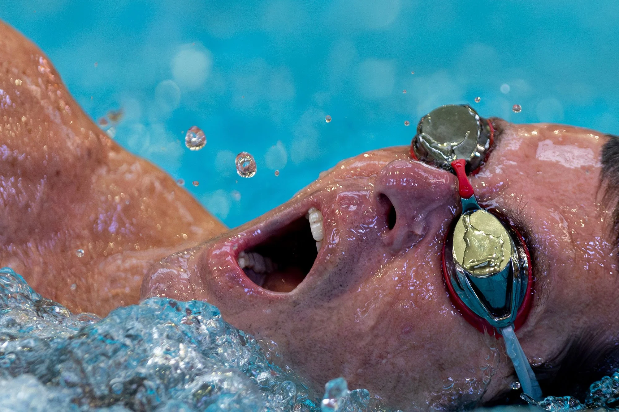 A participant comes up for air during the swimming stage of the inaugural Tiger Tri Indoor triathlon at the University of Missouri Student Recreation Complex on March 10, 2024.