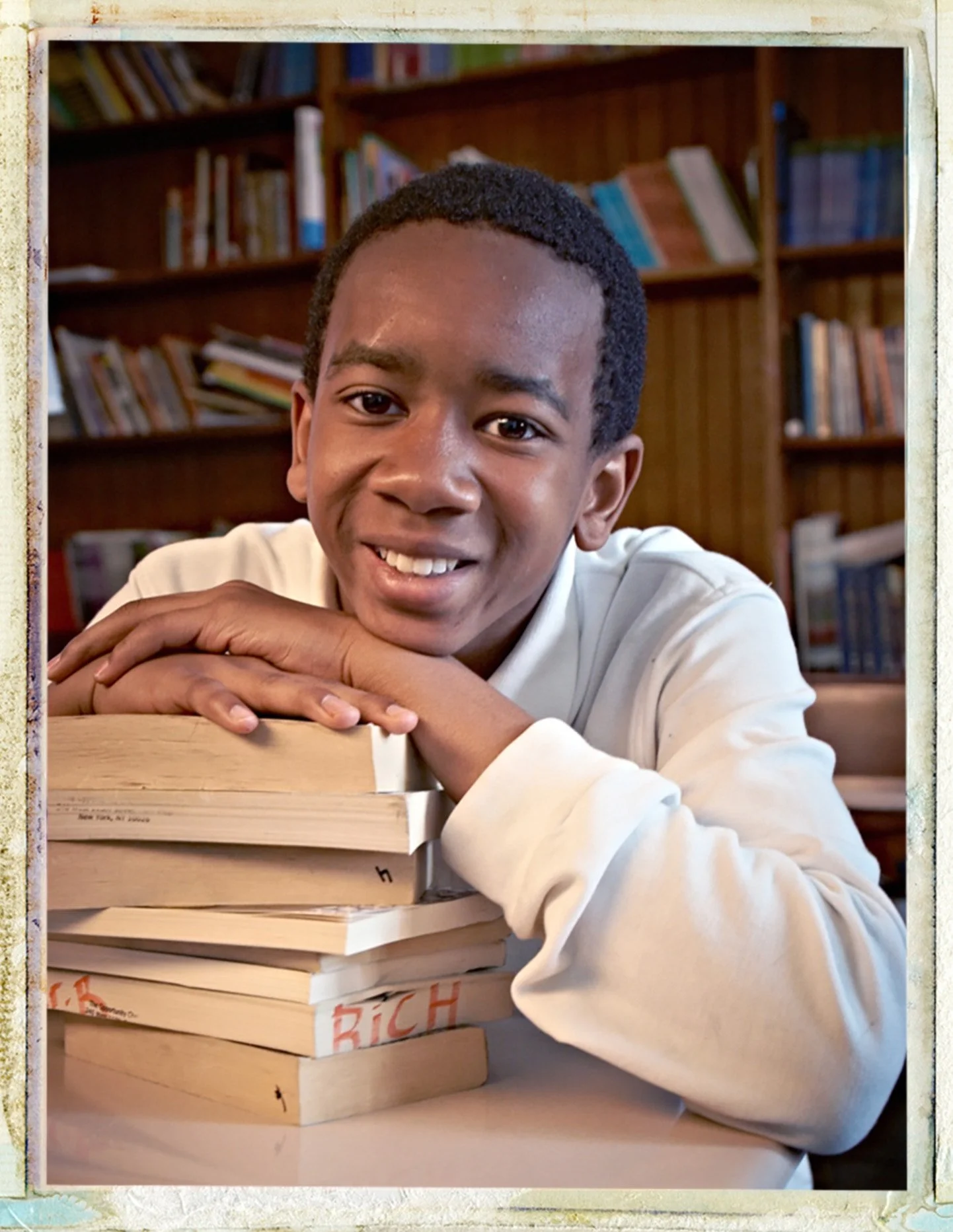 charter-school-student-portrait-stack-of-books-mister-lynch-photography.jpg