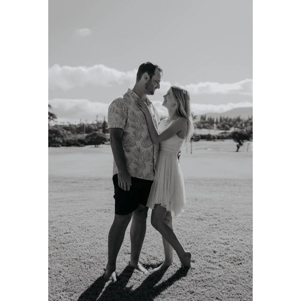 Newly Engaged Couple on the beach celebrating their love and new engagement