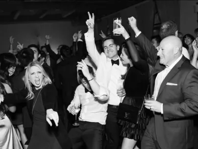 Black and white photo of a lively party with people dancing and celebrating at Royal Palms in Phoenix, Arizona