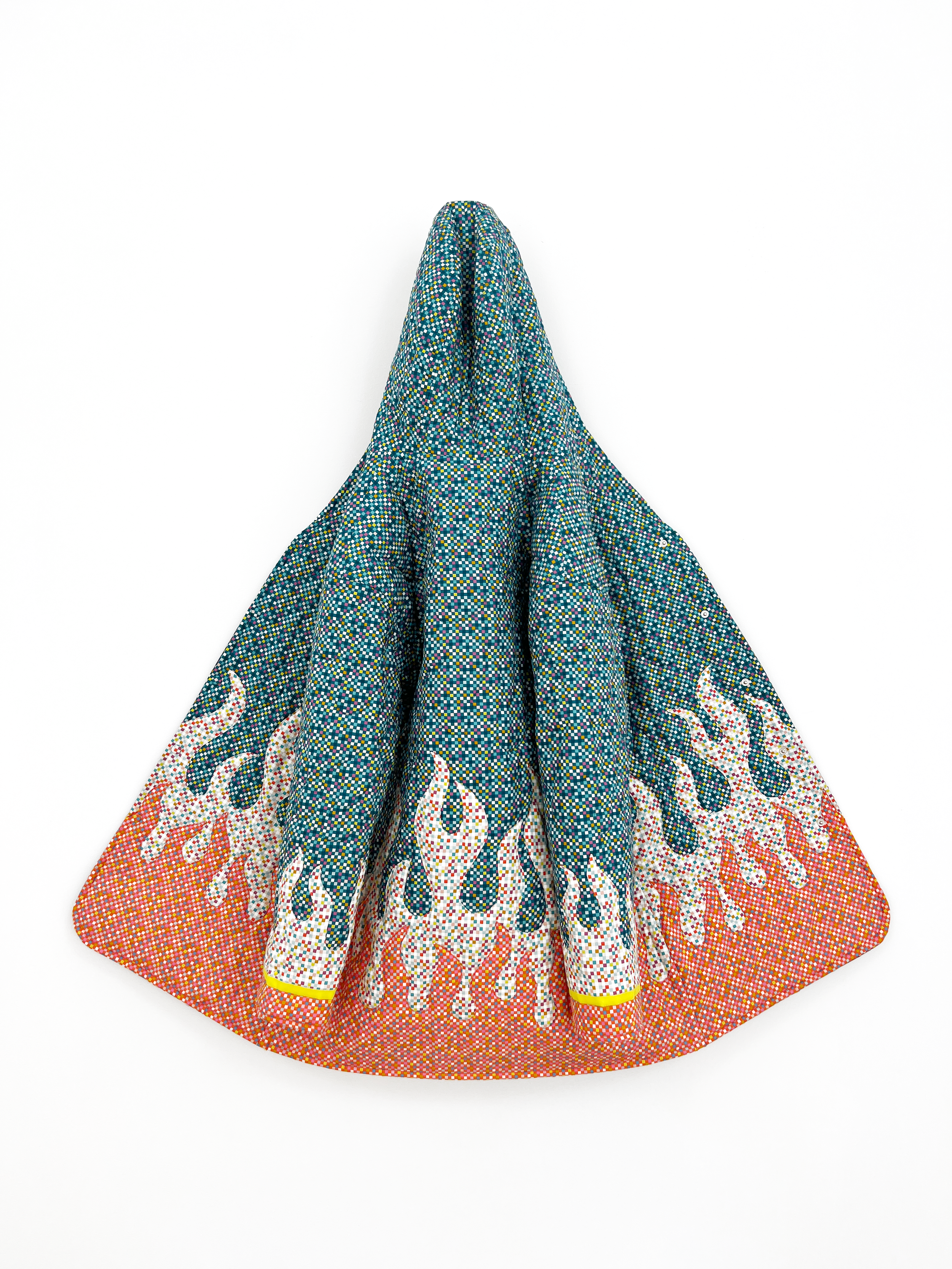 A traditional embroidered garment with a colorful pattern, featuring a flame design near the hem, displayed against a plain white background.