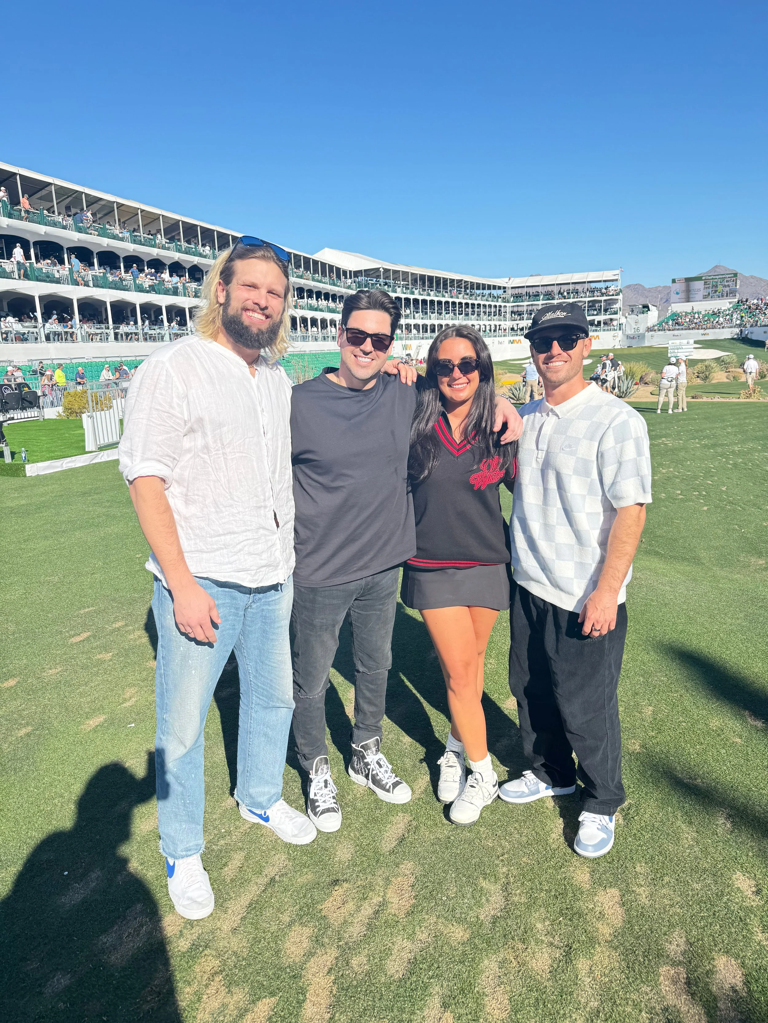 Threadline Collective team on the tee box during celebrity day at the Waste Management Open, capturing a live golf culture moment at a major PGA Tour event.