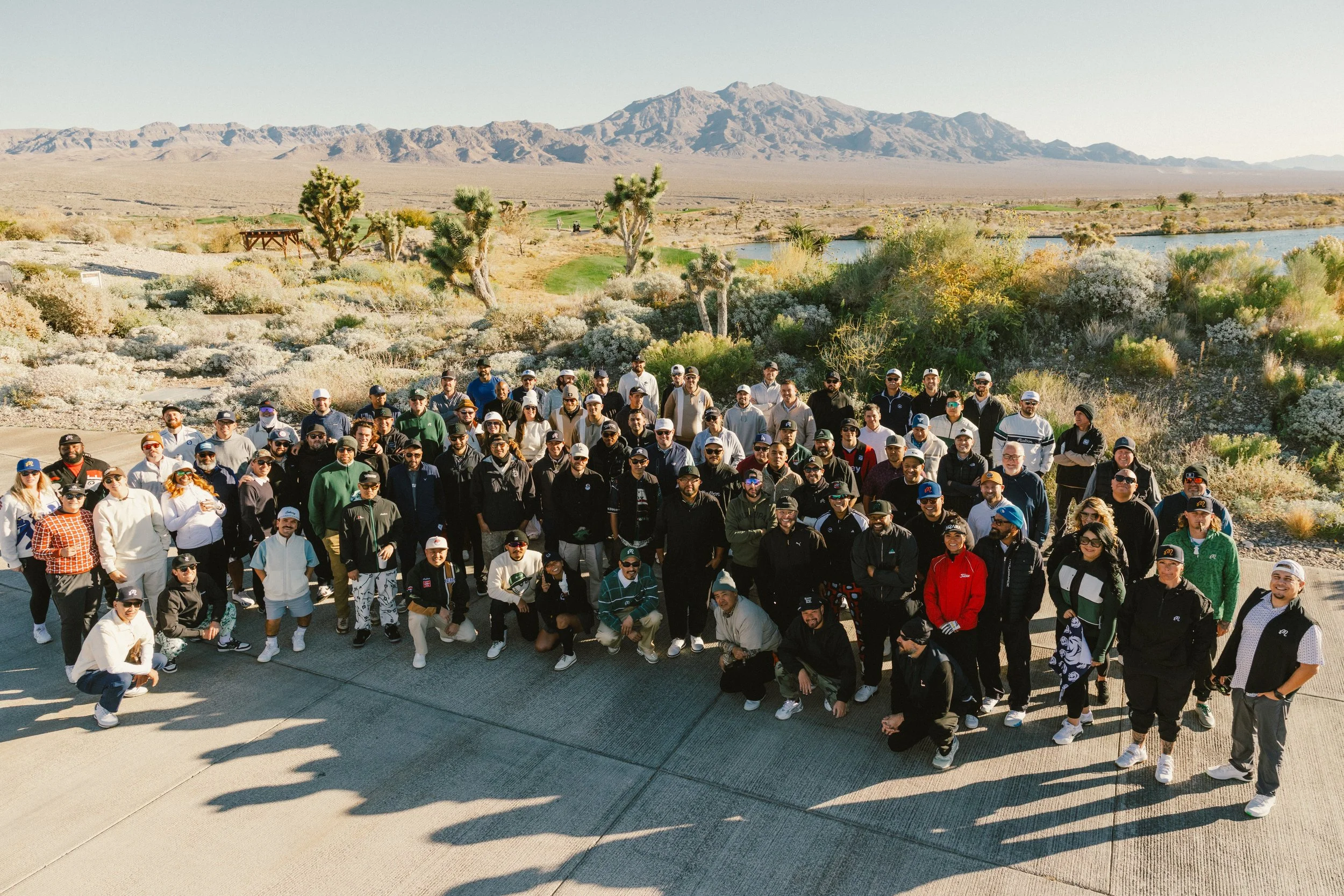 Malbon Buckets Club golfers gather for a picture with the Las Vegas desert in the background.