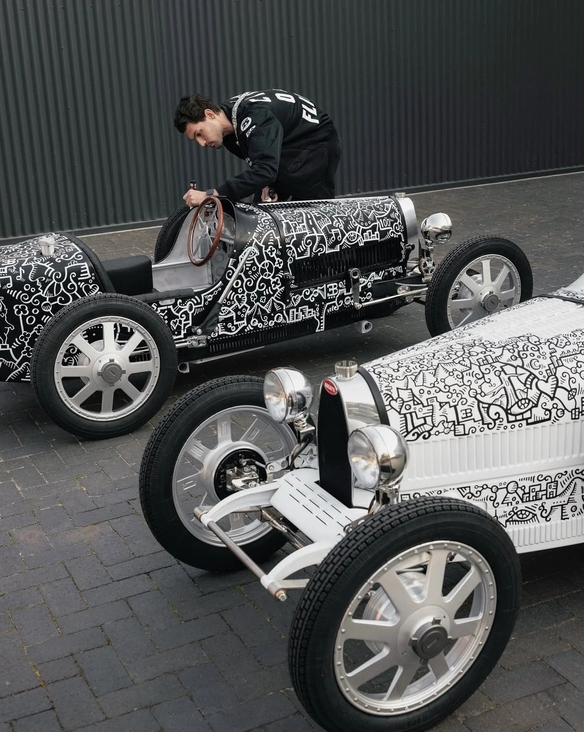 Threadline artist Alex Alpert illustrating custom artwork on a Bugatti commission, merging art, design, and automotive culture.