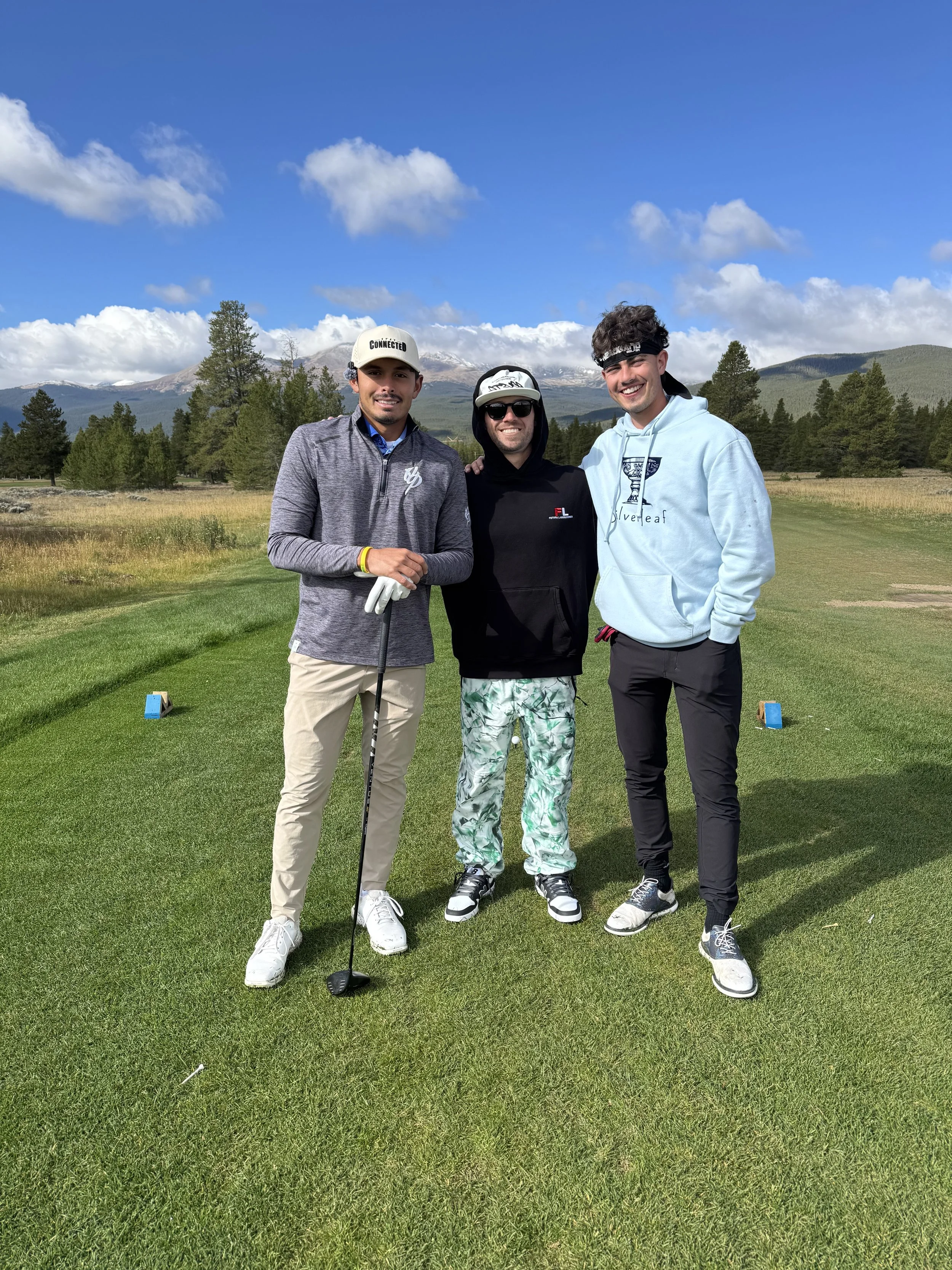 The Headband Golfer, The Connected Golfer and Dillon Denardo at the highest golf course in the world happily posing for a picture on the tee box